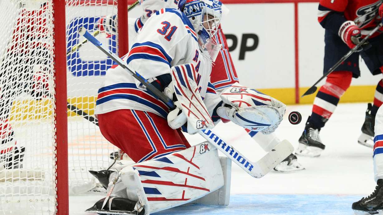 New York Rangers goaltender Igor Shesterkin (31) stops the puck during the first period of an NHL hockey game against the Washington Capitals, Friday, Oct. 9, 2026, in Washington.