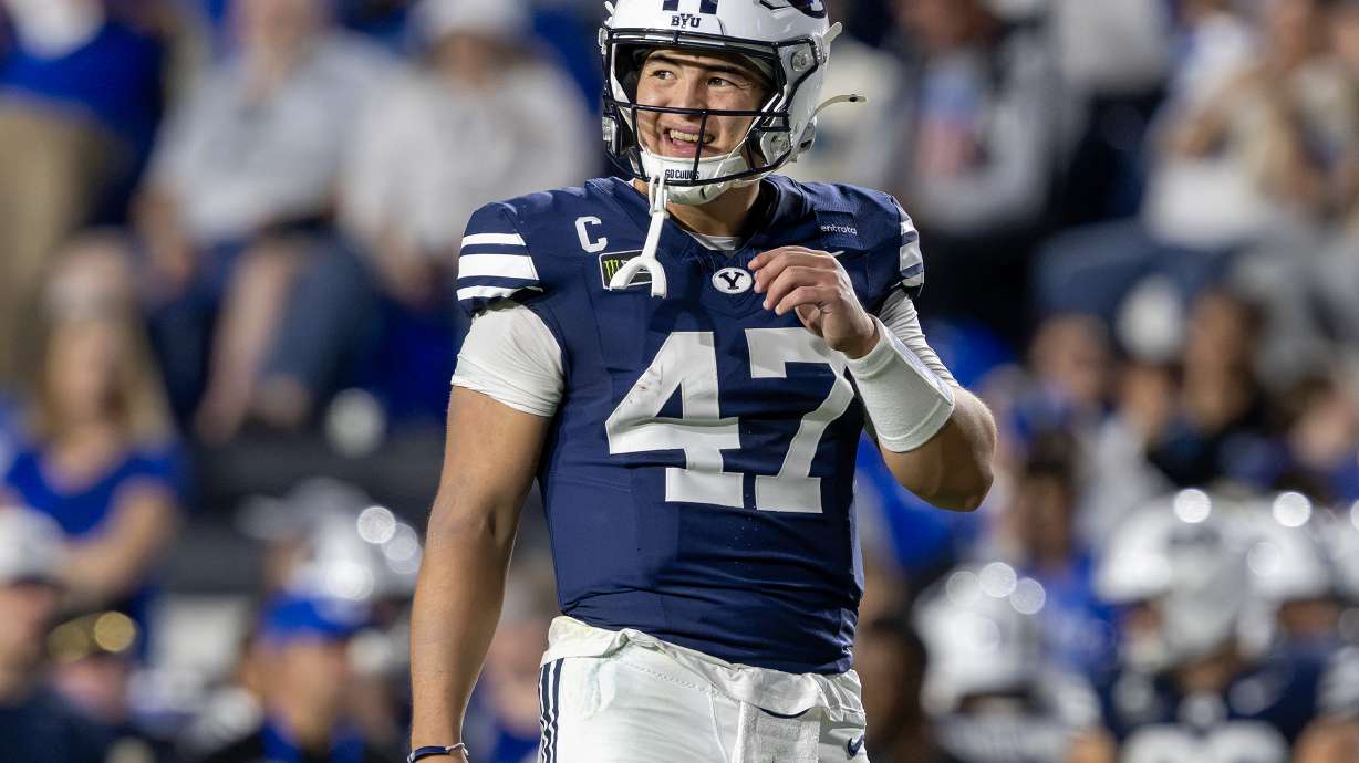 BYU quarterback Bear Bachmeier (47) smiles just before stepping into the huddle as BYU and Iowa State play at LaVell Edwards Stadium in Provo on Friday, Oct. 9, 2026.