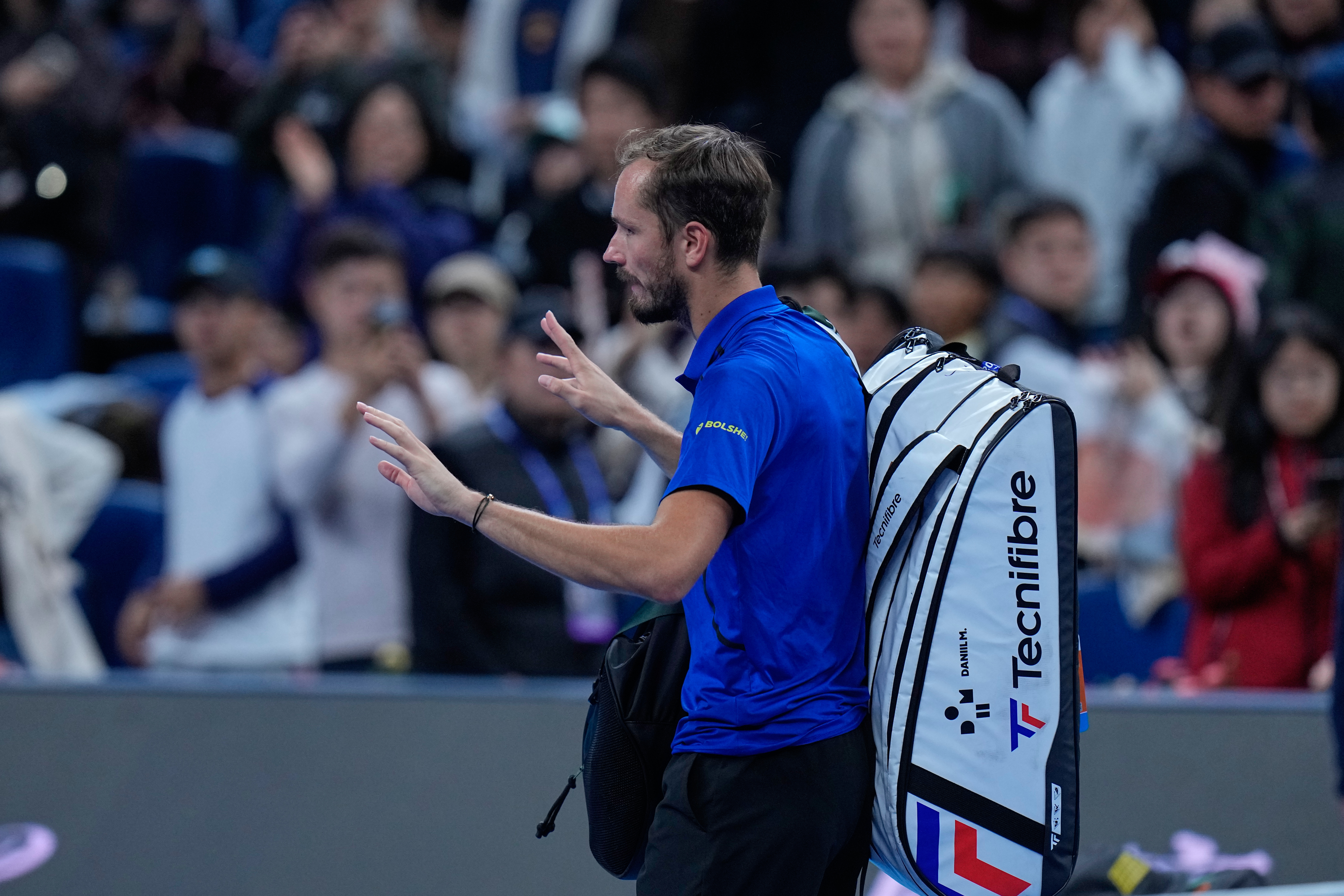 Daniil Medvedev, of Russia, leaves the court after being disqualified during a semi final match against Novak Djokovic, of Serbia at the China Open tennis tournament in Beijing, Monday, Oct. 5, 2026. 
