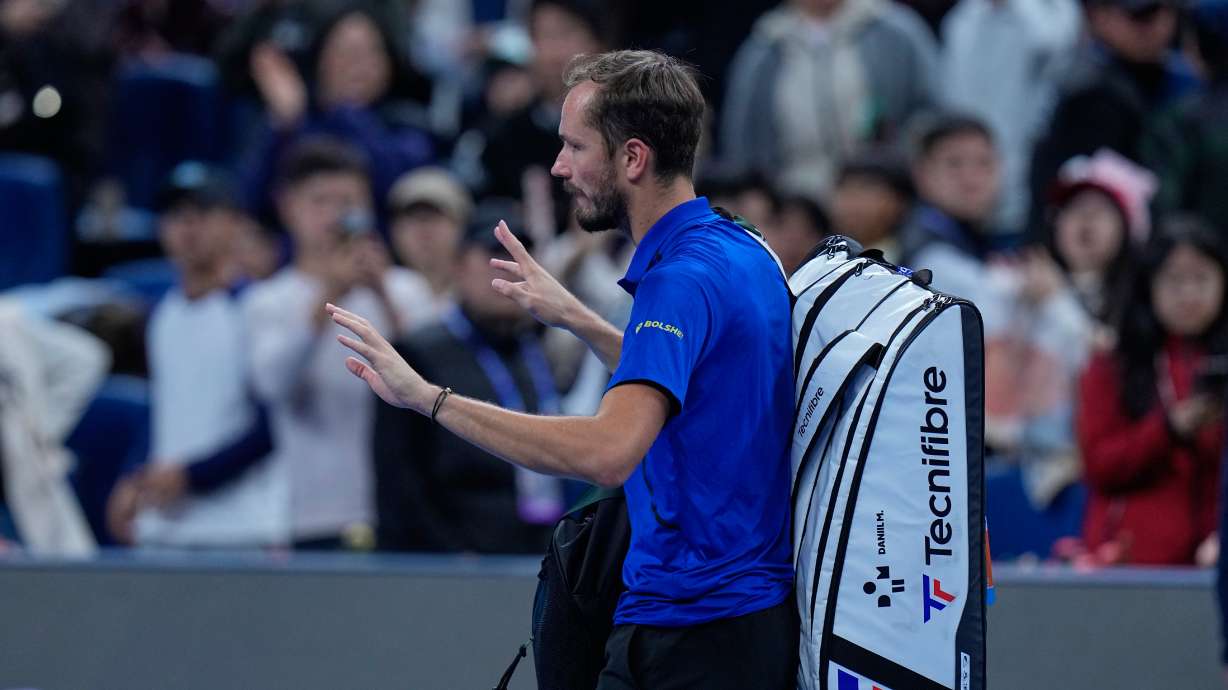 Daniil Medvedev, of Russia, leaves the court after being disqualified during a semi final match against Novak Djokovic, of Serbia at the China Open tennis tournament in Beijing, Monday, Oct. 5, 2026.
