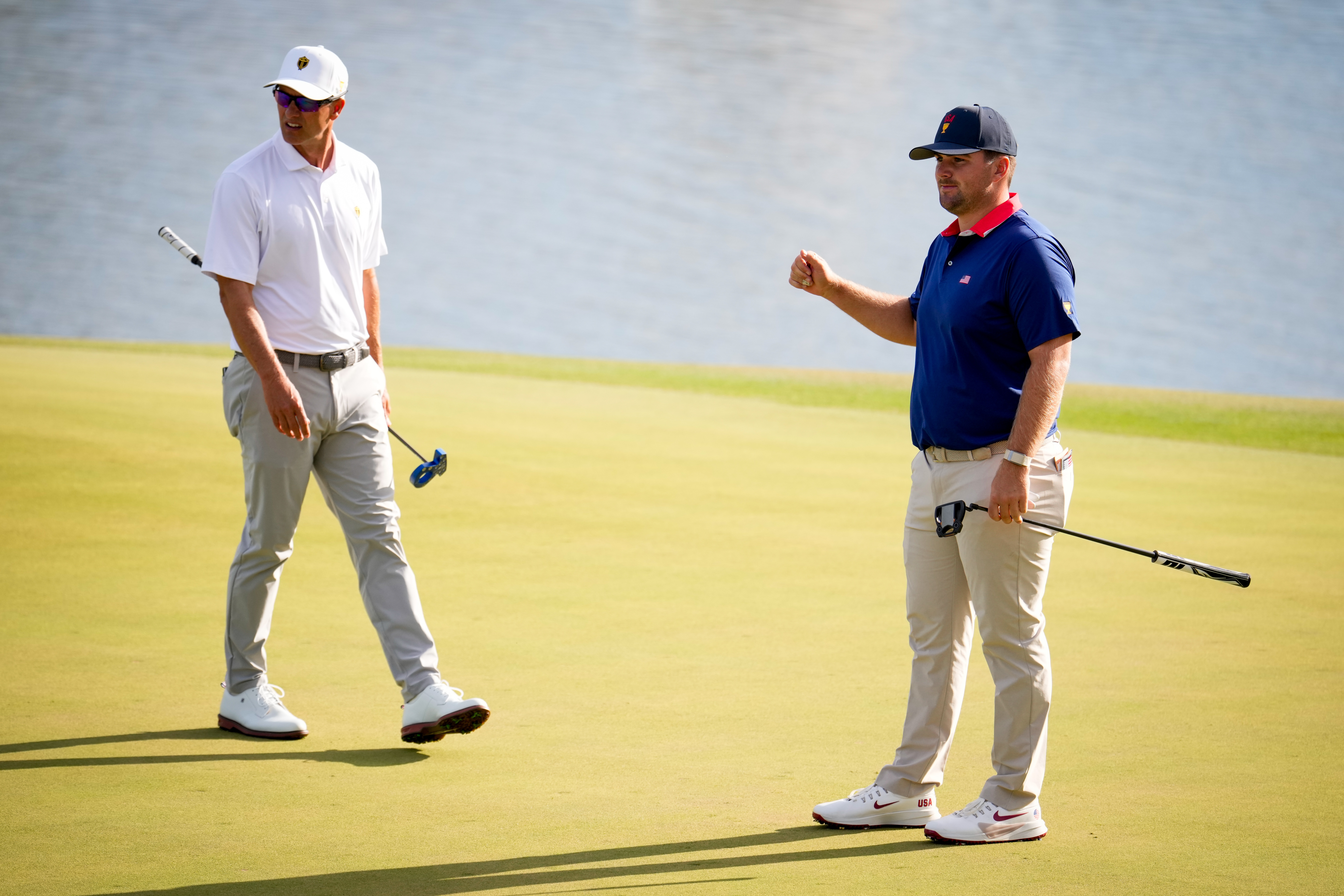 USA teams' Chris Gotterup, right, watches his ball miss the cup as International teams' Adam Scott, of Australia, looks on during a Presidents Cup golf tournament third round foursome match at Medinah Country Club, Saturday, Sept. 26, 2026, in Medinah, Ill. 