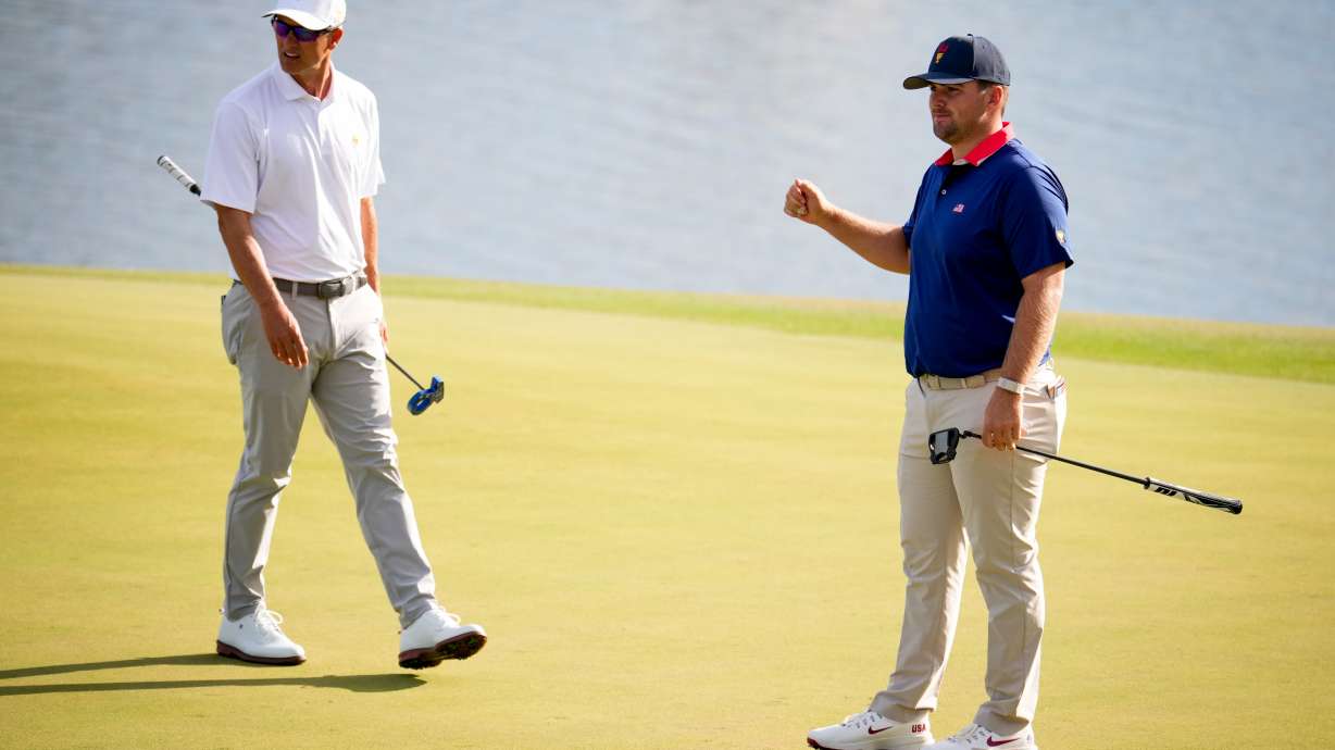 USA teams' Chris Gotterup, right, watches his ball miss the cup as International teams' Adam Scott, of Australia, looks on during a Presidents Cup golf tournament third round foursome match at Medinah Country Club, Saturday, Sept. 26, 2026, in Medinah, Ill.