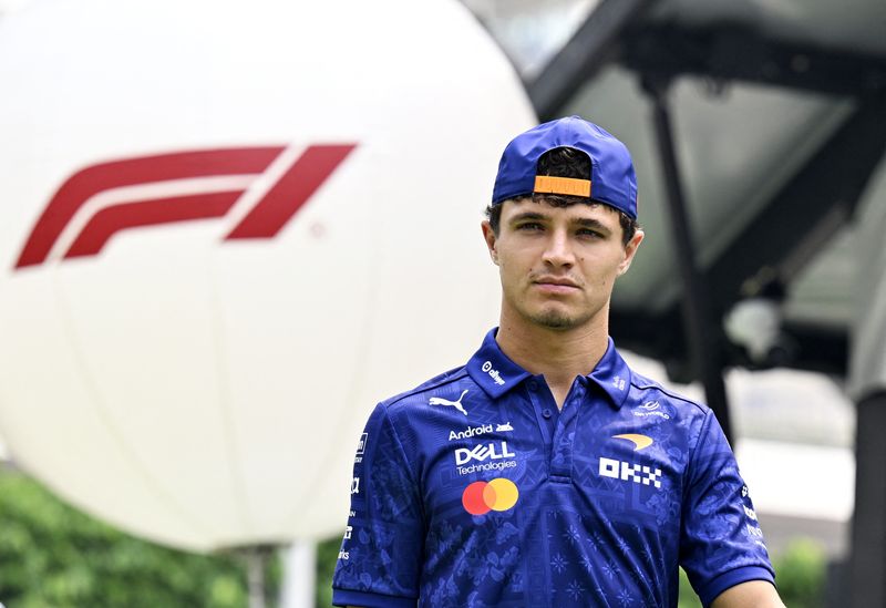 Formula One F1 - Singapore Grand Prix - Marina Bay Street Circuit, Singapore - October 9, 2026 McLaren's Lando Norris arrives ahead of practice