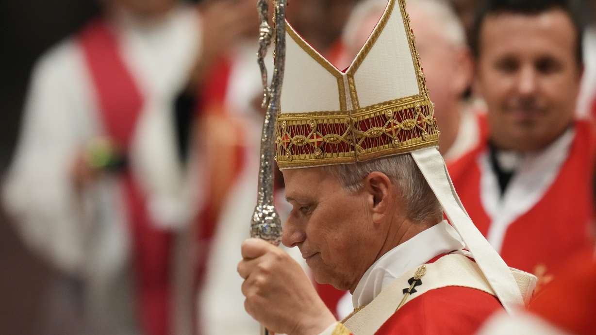 Pope Leo XIV arrives to celebrate a mass in St. Peter's Basilica at the Vatican, Thursday, for the annual opening of the academic year at pontifical universities, joining Rome's 22 pontifical institutions and numerous others worldwide.