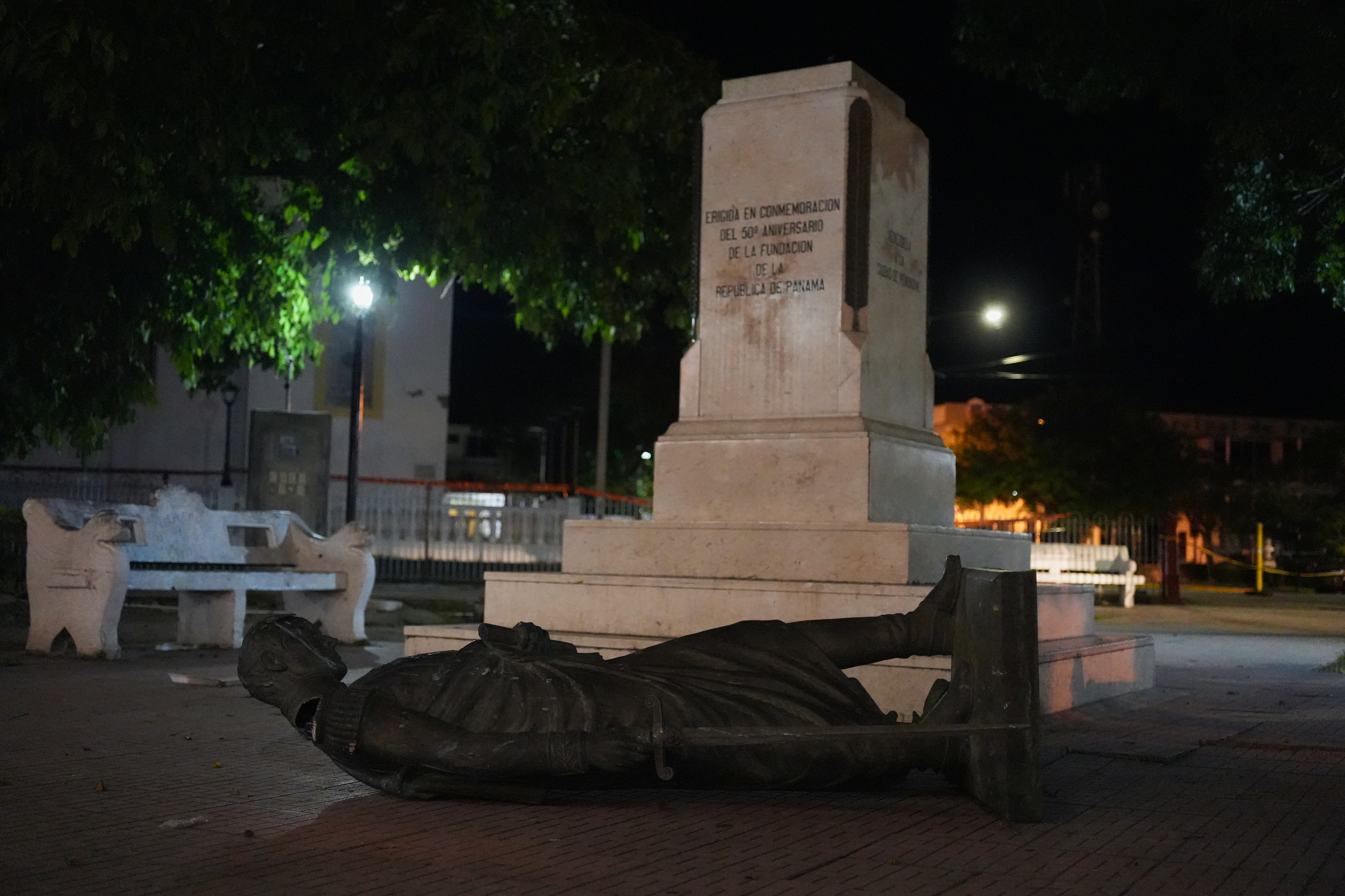 A statue lies on the ground after being knocked off its pedestal by an earthquake in Penonome, Panama, Friday. There were no people reported missing, officials said.