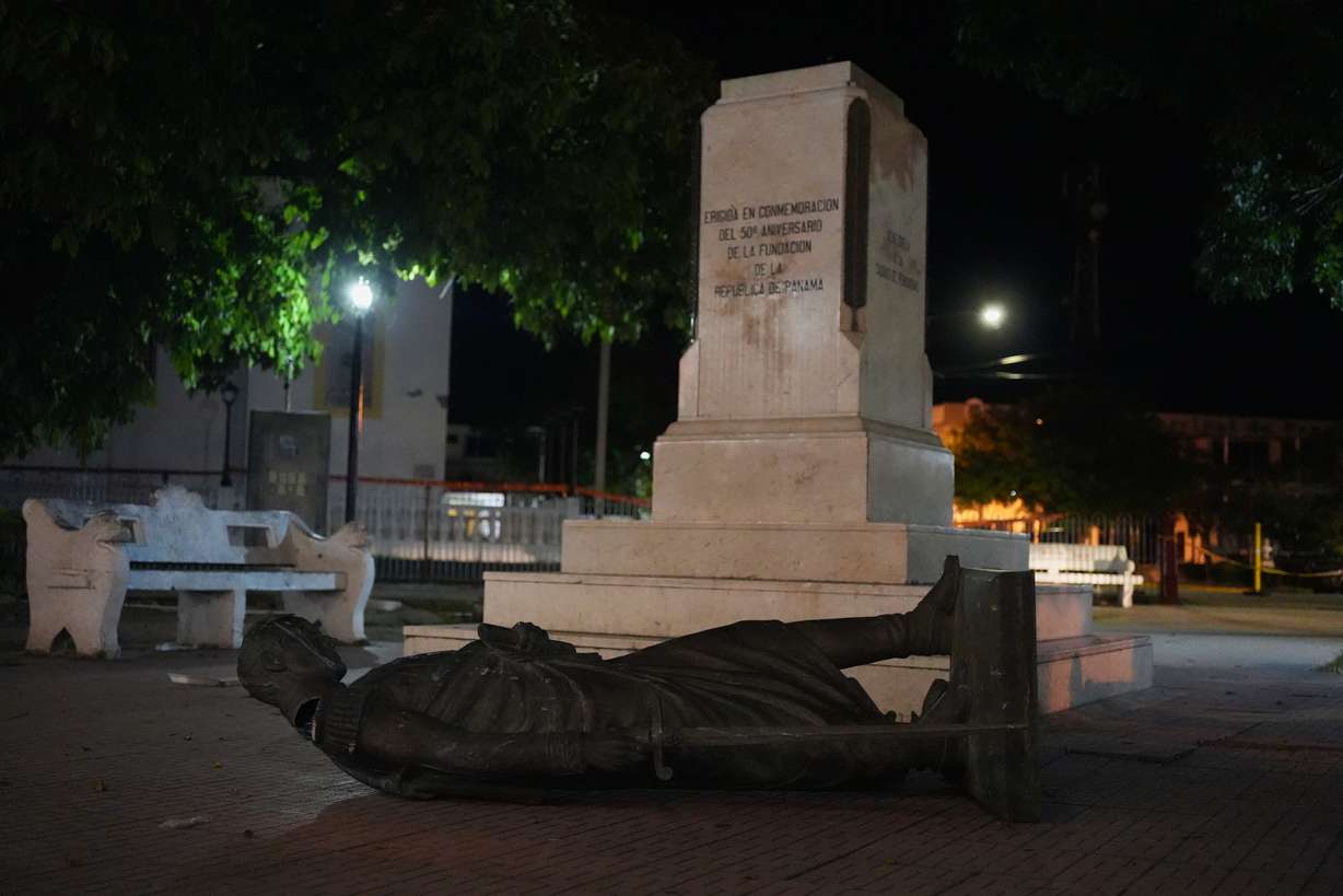 A statue lies on the ground after being knocked off its pedestal by an earthquake in Penonome, Panama, Friday. There were no people reported missing, officials said.