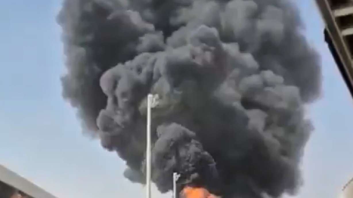 Thick black smoke and flames rising from a fire at King Khalid International Airport in Riyadh, Saudi Arabia, Friday. The airport was hit again on Saturday, leaving President Donald Trump weighing whether to join the conflict.