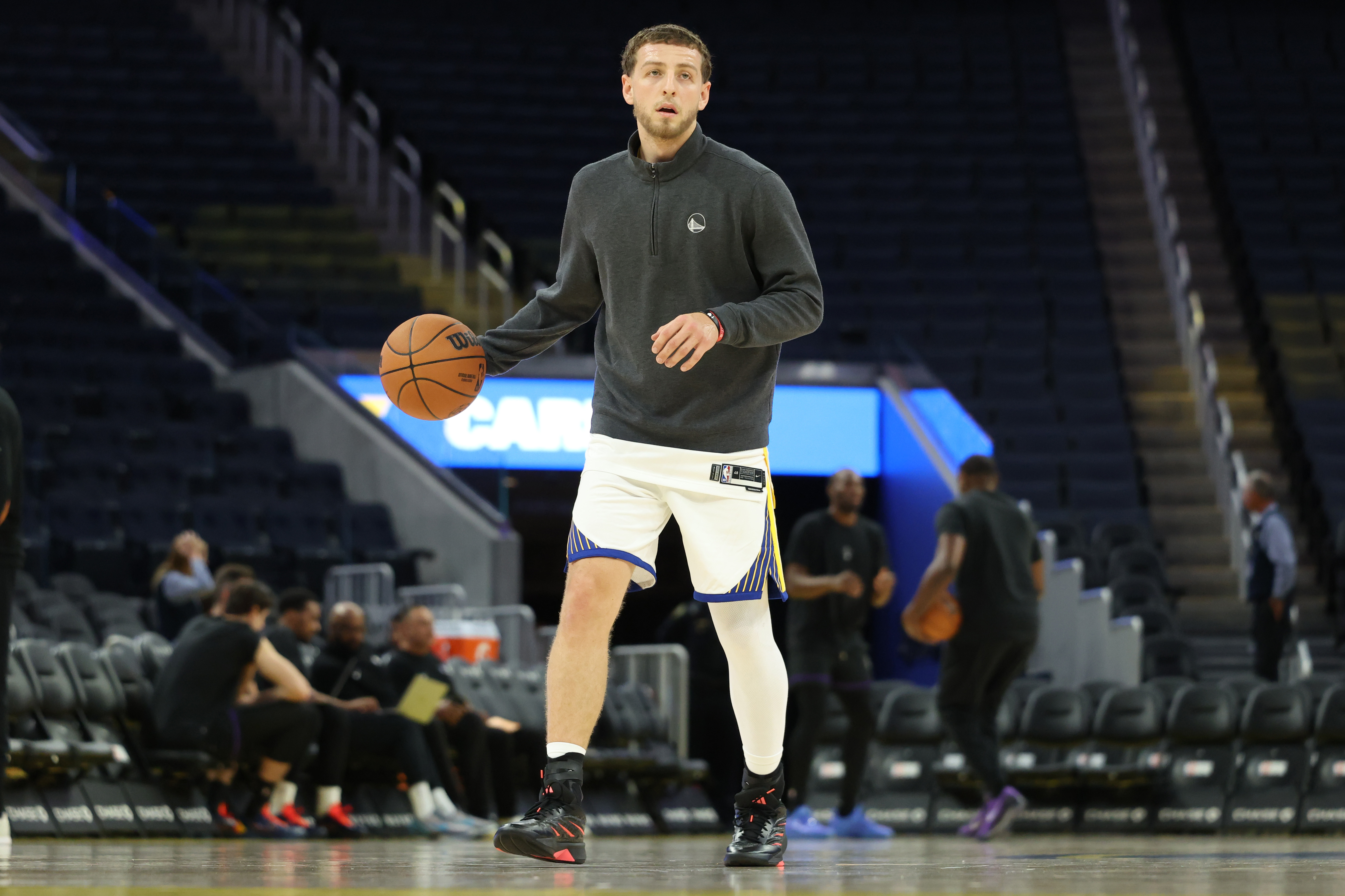 Golden State Warriors guard Brandin Podziemski warms up before a preseason NBA basketball game against the Sacramento Kings in San Francisco, Saturday, Oct. 10, 2026. 