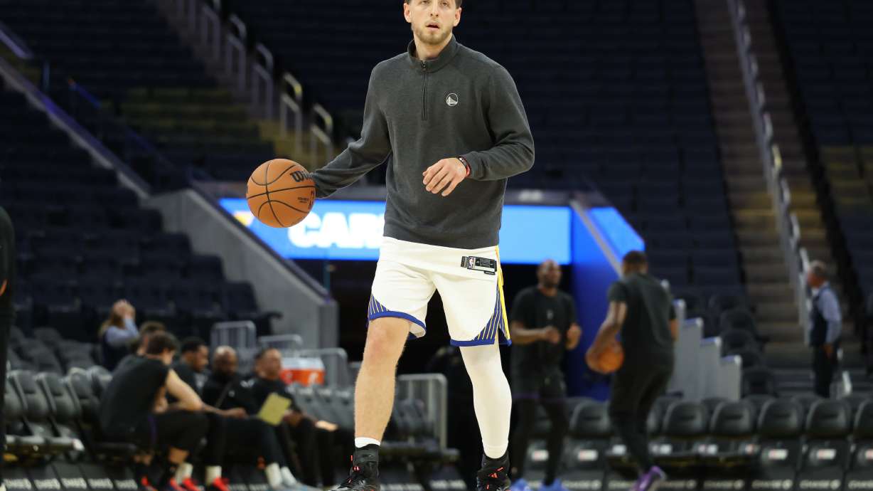 Golden State Warriors guard Brandin Podziemski warms up before a preseason NBA basketball game against the Sacramento Kings in San Francisco, Saturday, Oct. 10, 2026.