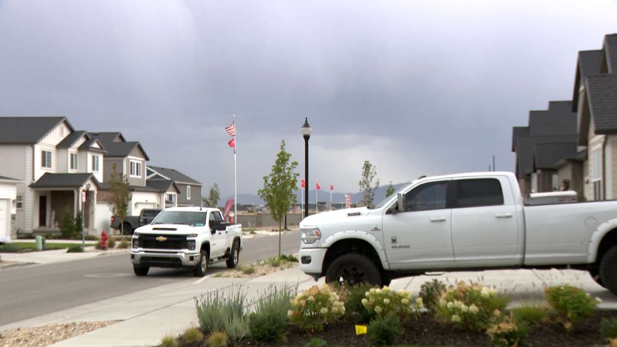Dark clouds bringing rain move toward West Jordan, Saturday.