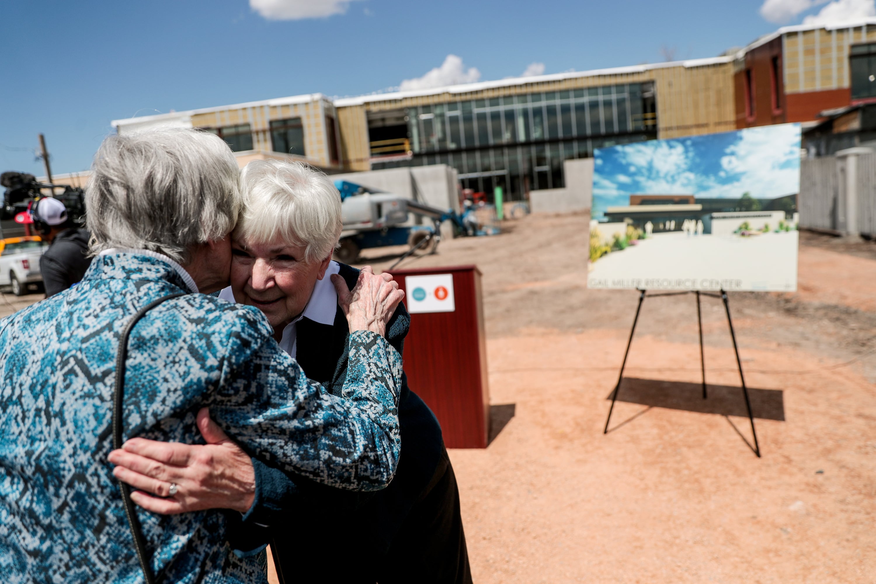 Pamela Atkinson, an advocate for homeless individuals embraces Gail Miller, then-owner of the Utah Jazz, at the not-yet-finished Gail Miller Resource Center in Salt Lake City on May 2, 2019. Atkinson died on Saturday at the age of 93.