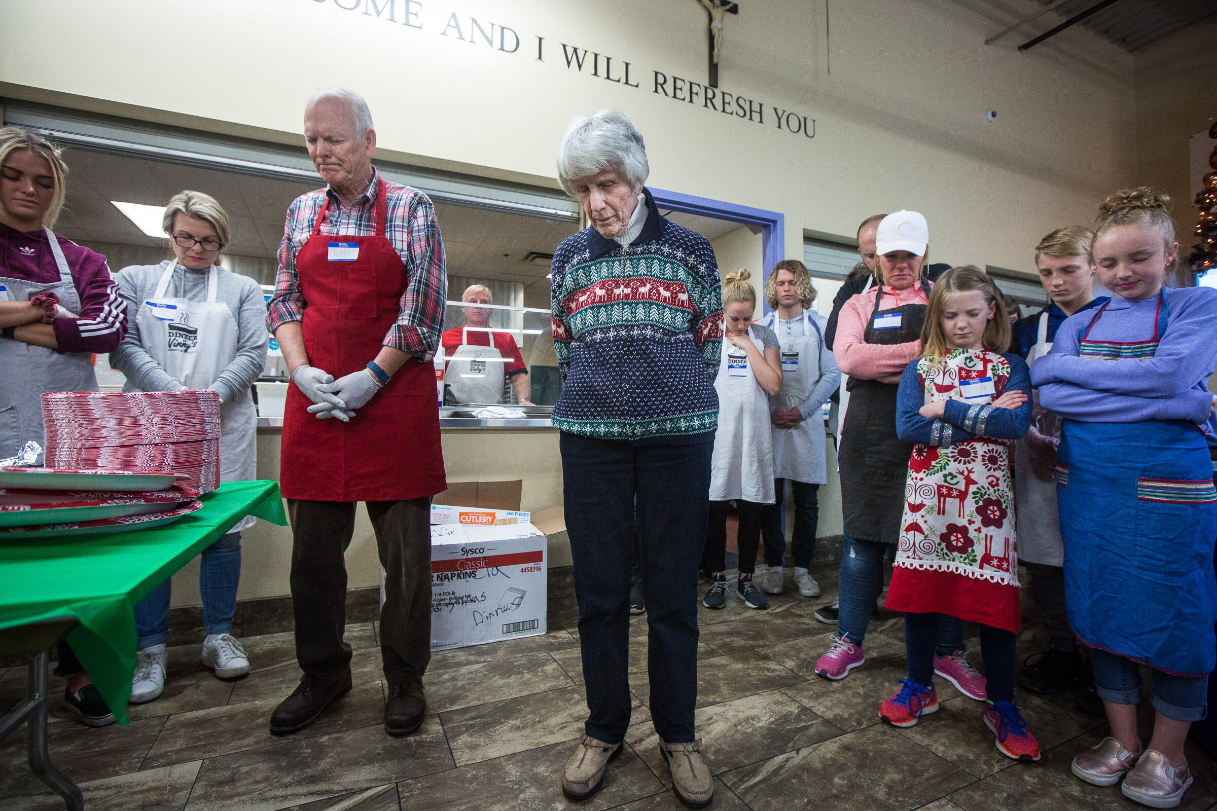 Pamela Atkinson during a prayer before the annual Christmas dinner for more than 800 homeless and low-income Utahns at St. Vincent de Paul Dining Hall in Salt Lake City on Dec. 25, 2018. Atkinson died on Saturday at the age of 93.