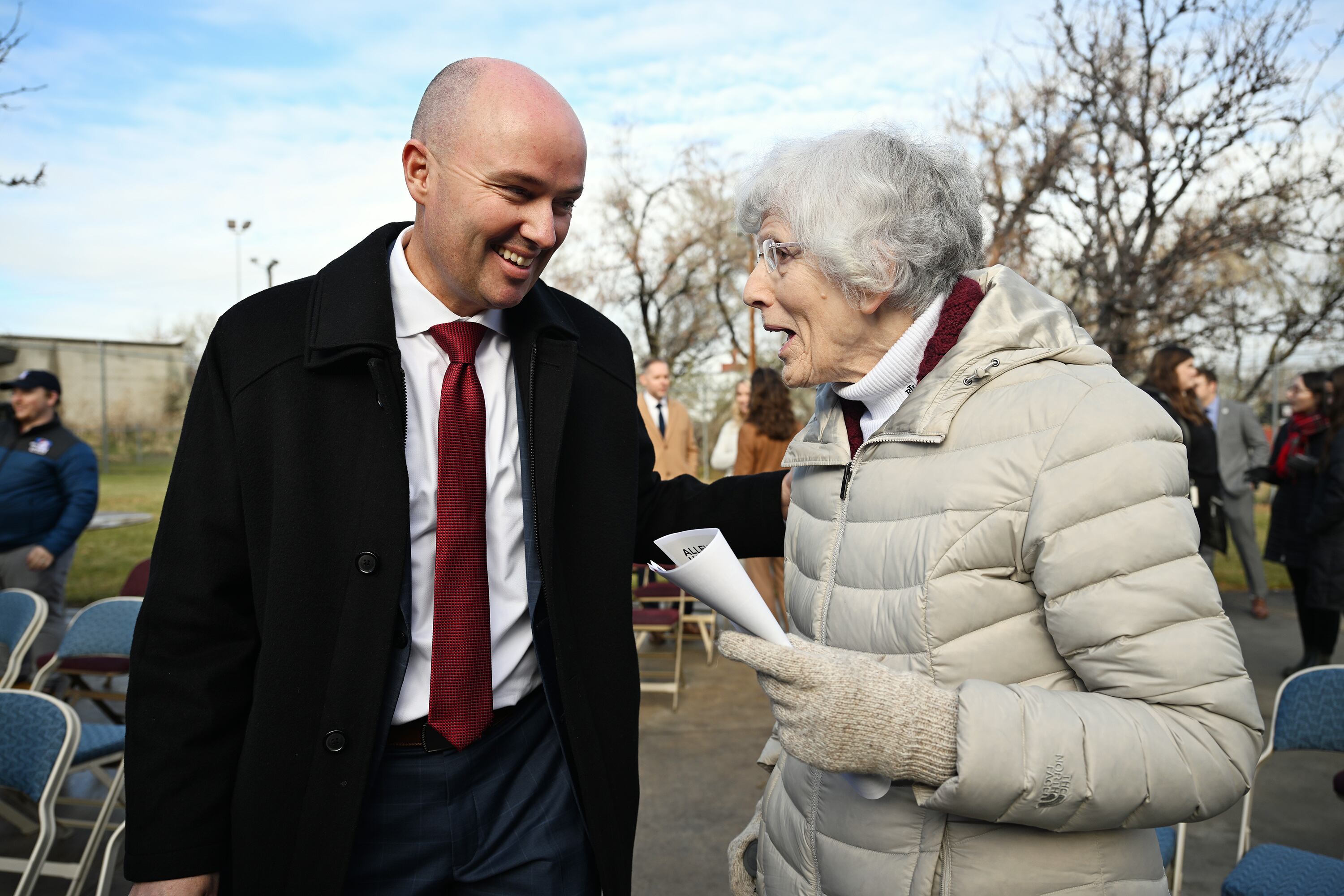 Gov. Spencer Cox talks with Pamela Atkinson, adviser to the governor, after he unveiled the state's 2025 homelessness plan at a press conference at Atherton Community Treatment Center in West Valley City on Dec. 4, 2023. Atkinson died on Saturday at the age of 93.