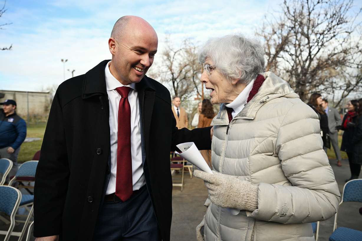 Gov. Spencer Cox talks with Pamela Atkinson, adviser to the governor, after he unveiled the state's 2025 homelessness plan at a press conference at Atherton Community Treatment Center in West Valley City on Dec. 4, 2023. Atkinson died on Saturday at the age of 93.