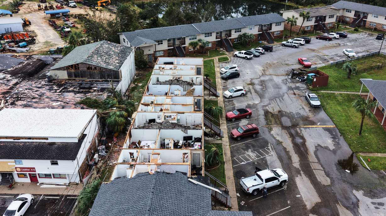 An apartment complex which had its roof ripped off is seen in the aftermath of Hurricane Isaias in Milton, Fla., Saturday.