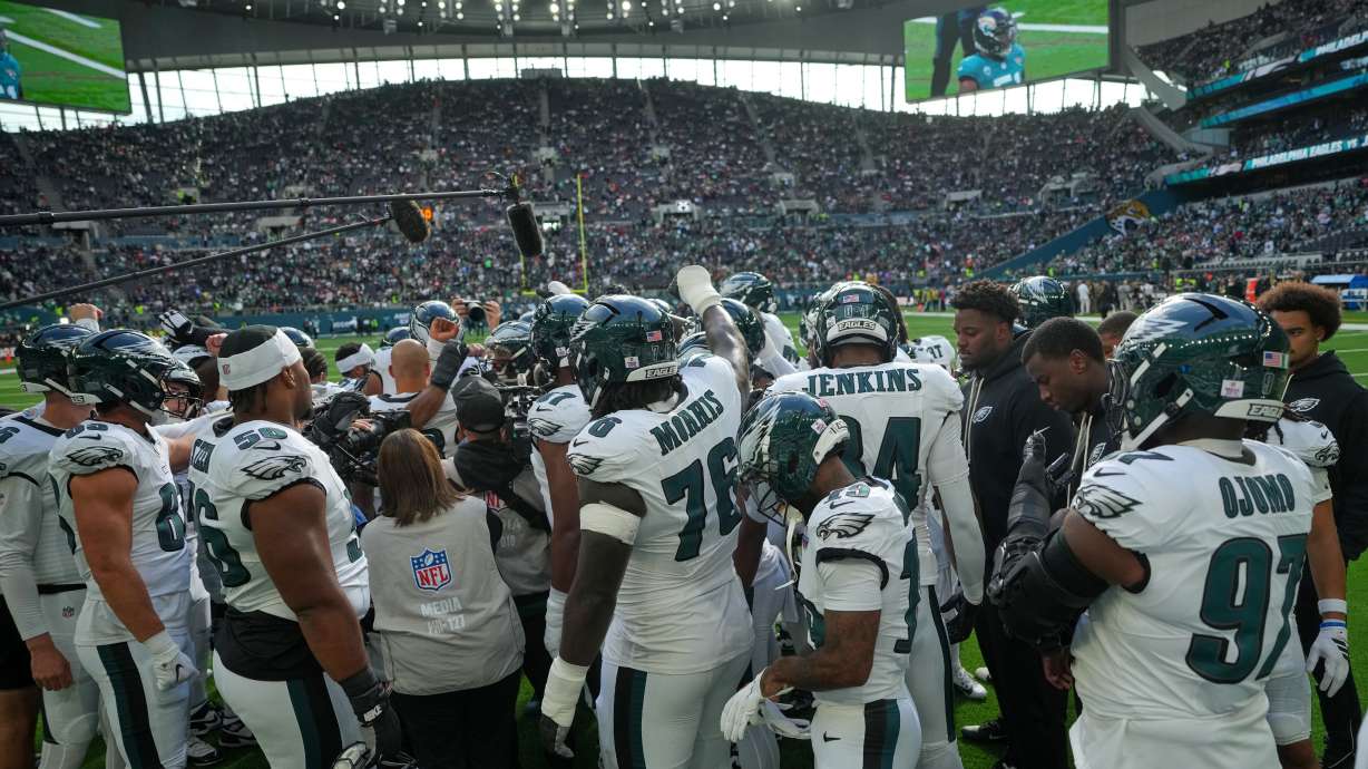 Philadelphia Eagles players gather during the warm-up before an NFL football game against Jacksonville Jaguars in London, Sunday, Oct. 11, 2026.