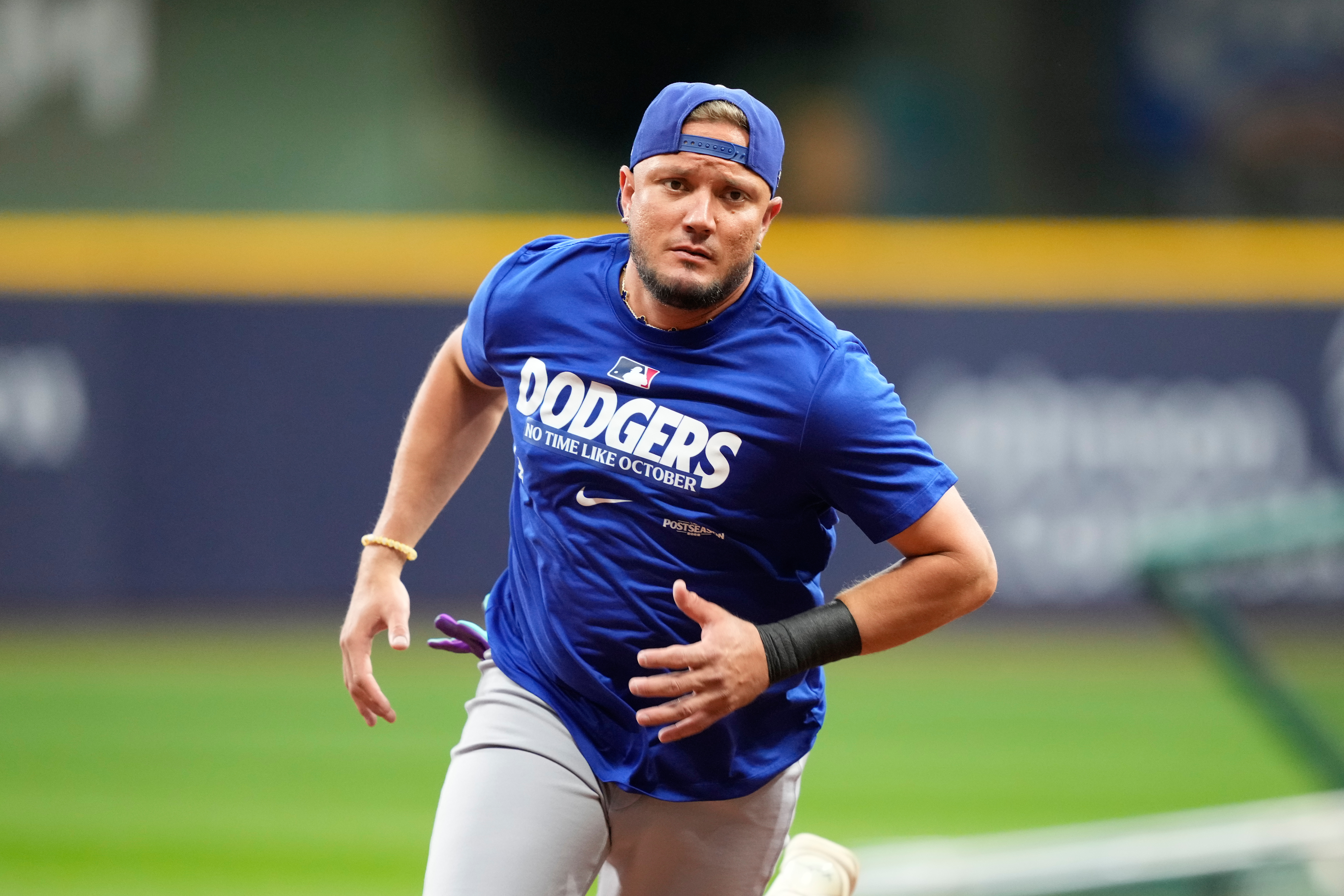 Los Angeles Dodgers' Miguel Rojas works out ahead of Game 1 of baseball's National League Championship Series between the Milwaukee Brewers and the Los Angeles Dodgers, Saturday, Oct. 10, 2026, in Milwaukee. 