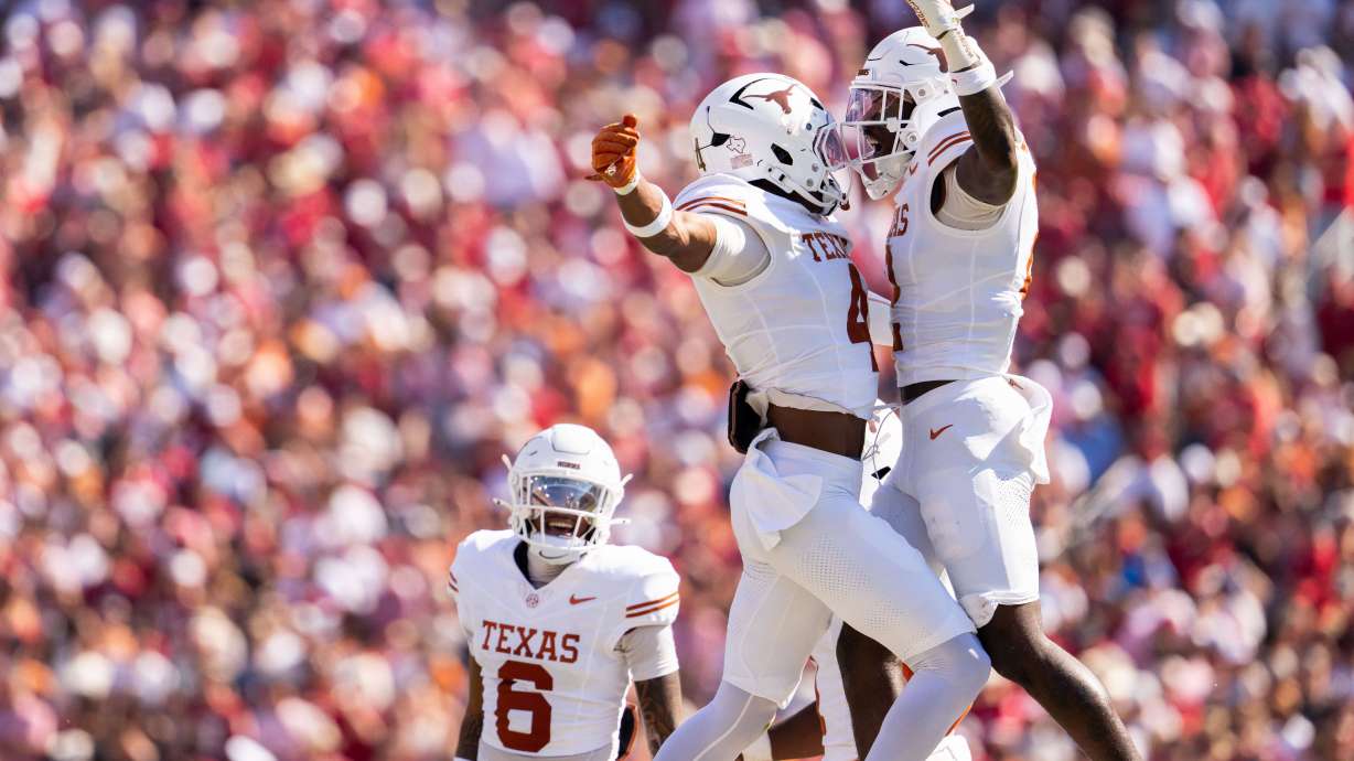 Texas Longhorns defensive backs Jelani McDonald, left, and Derek Williams Jr. celebrate a defensive stop as defensive back Kobe Black (6) looks on during the first half of an NCAA college football game against Oklahoma, Saturday, Oct. 10, 2026, in Dallas.