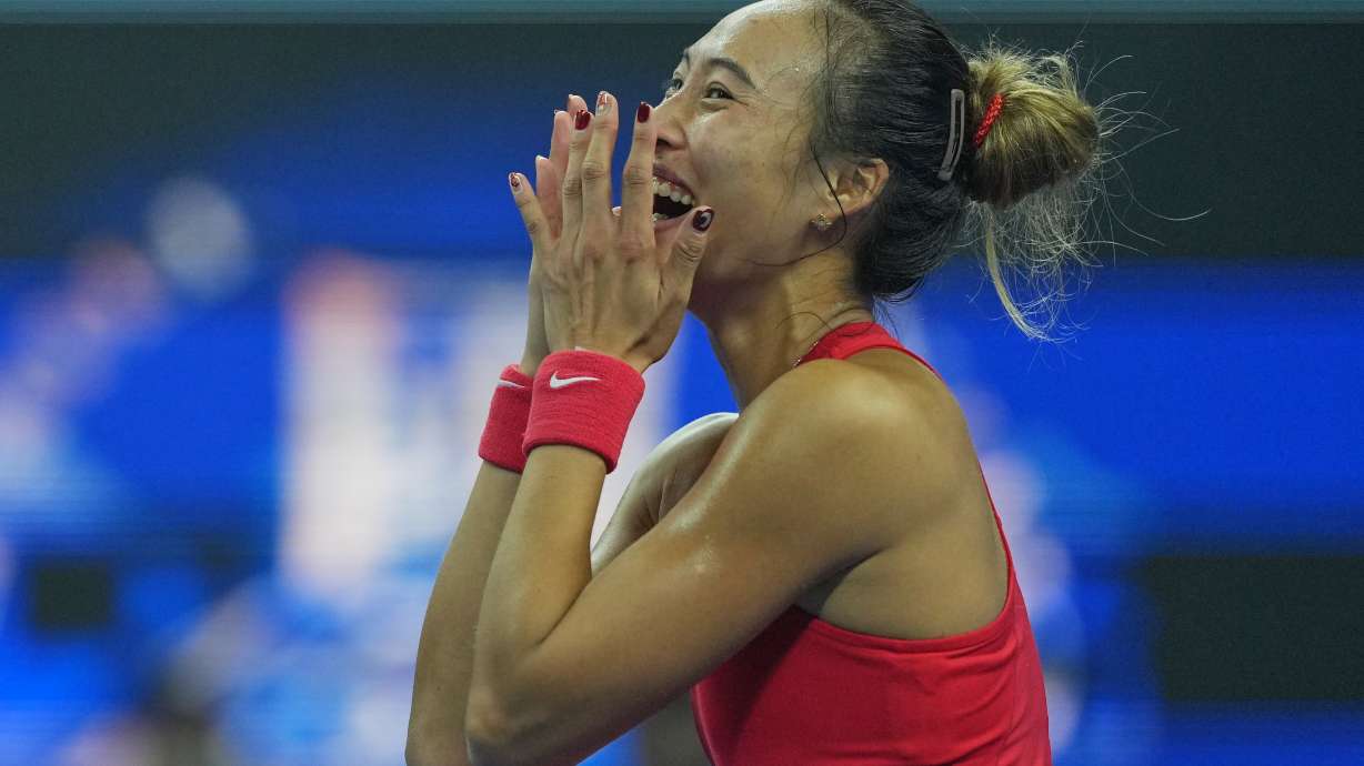 Zheng Qinwen, of China, celebrates after winning the women's singles final match against a Mirra Andreeva, of Russia at the China Open tennis tournament in Beijing, Sunday, Oct. 11, 2026.