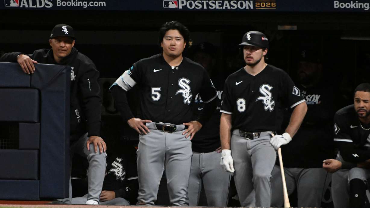 Chicago White Sox first baseman Munetaka Murakami (5) and catcher Kyle Teel (8) watch from the dugout during the eighth inning of Game 5 of baseball's American League Division Series against the Cleveland Guardians, Saturday, Oct. 10, 2026, in Cleveland.