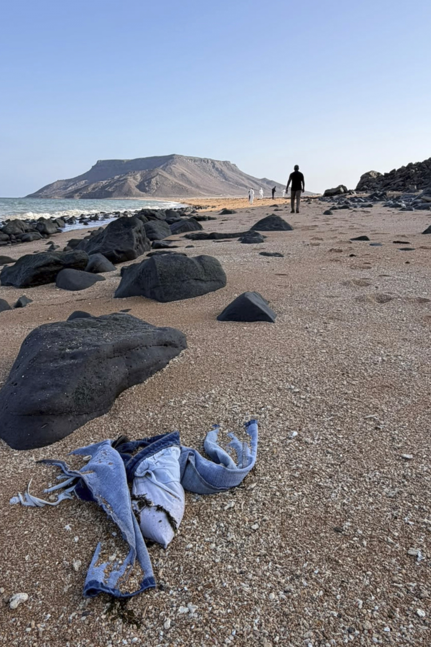 This image provided by the International Organization for Migration shows authorities intervening after a migrant ship capsized near Guhere, north of Obock, in Djibouti, Saturday.