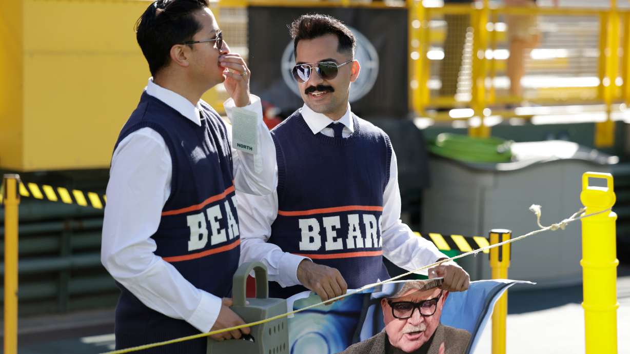 Chicago Bears fans dress up as Mike Ditka before an NFL football game against the Green Bay Packers in Green Bay, Wis., Sunday, Oct. 11, 2026.