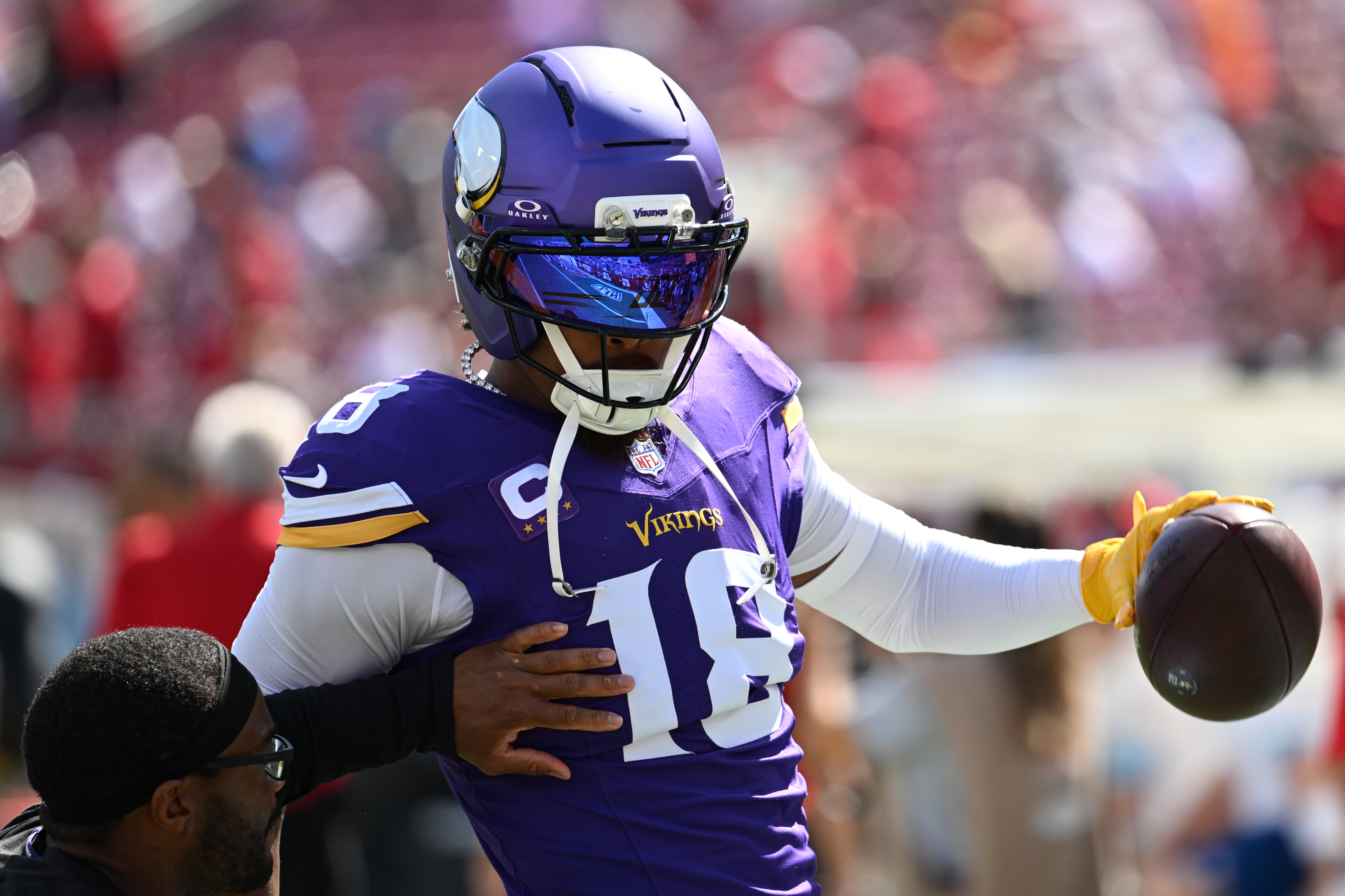 Minnesota Vikings wide receiver Justin Jefferson (18) warms up before an NFL football game against the Tampa Bay Buccaneers in Tampa, Fla., Sunday, Sept. 27, 2026. 
