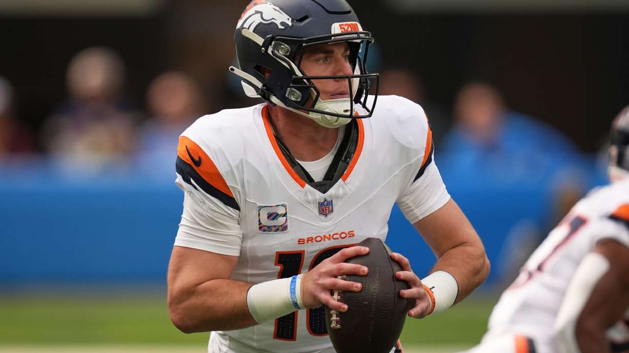 Denver Broncos quarterback Bo Nix gets set to pass during the first half of an NFL football game against the Los Angeles Chargers, Sunday, Oct. 11, 2026, in Inglewood, Calif.