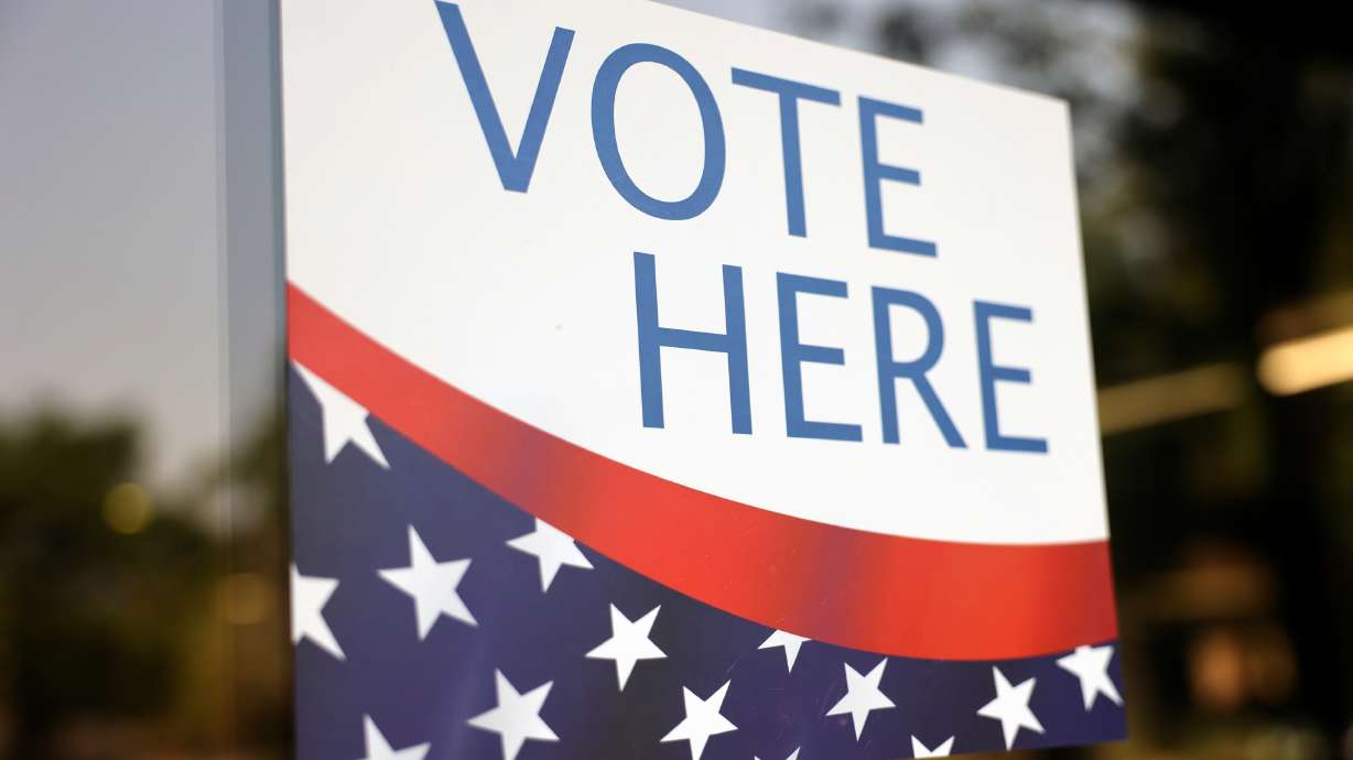 A "Vote Here" sign is pictured at the Salt Lake County Government Center in Salt Lake City, June 23.