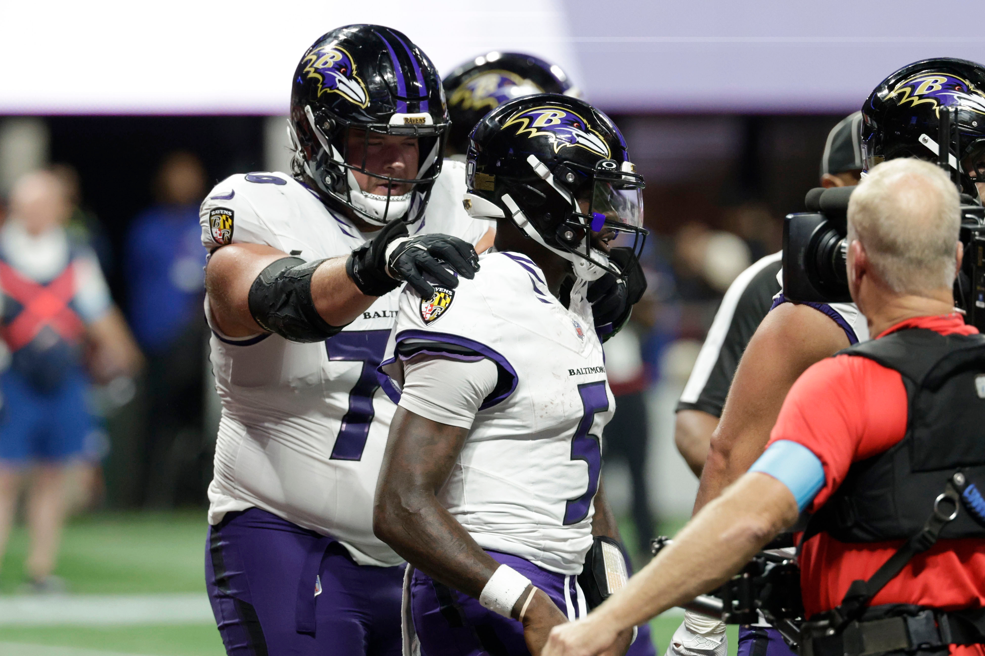 Baltimore Ravens quarterback Tyler Huntley (5) celebrates with teammates after a touchdown run during overtime in a NFL football game against the Atlanta Falcons, Sunday, Oct. 11, 2026, in Atlanta. 