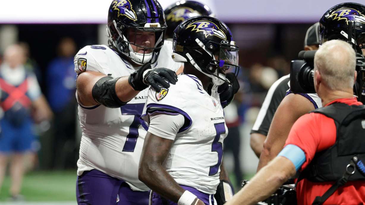 Baltimore Ravens quarterback Tyler Huntley (5) celebrates with teammates after a touchdown run during overtime in a NFL football game against the Atlanta Falcons, Sunday, Oct. 11, 2026, in Atlanta.