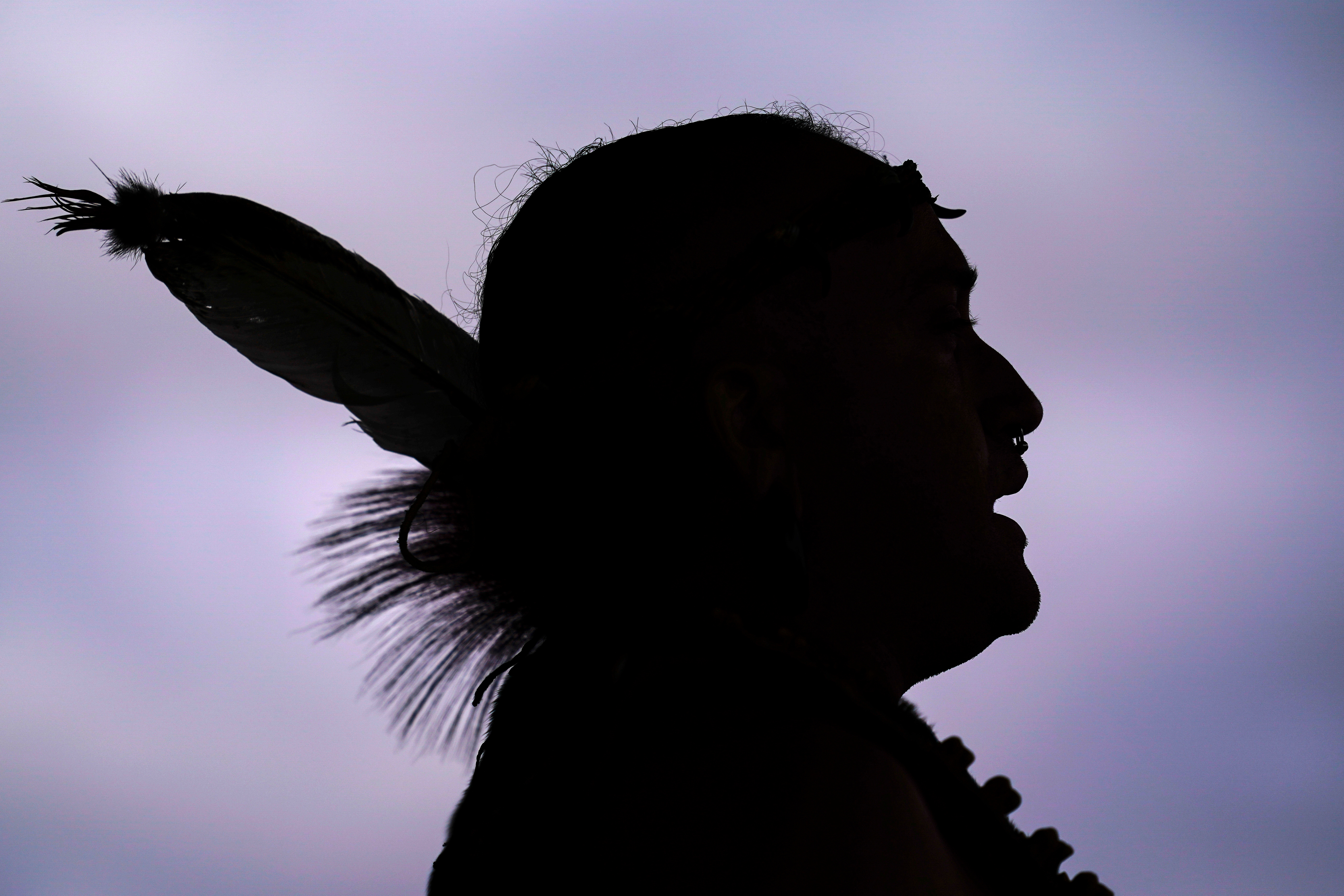 Tatanka Gibson of the Haliwa-Saponi/Nansemond Tribal Nations leads attendees in song and dance during a gathering marking Indigenous Peoples Day at Penn Treaty Park, Oct. 11, 2021, in Philadelphia.