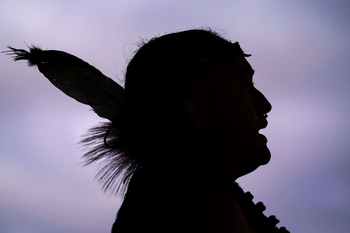 Tatanka Gibson of the Haliwa-Saponi/Nansemond Tribal Nations leads attendees in song and dance during a gathering marking Indigenous Peoples Day at Penn Treaty Park, Oct. 11, 2021, in Philadelphia.