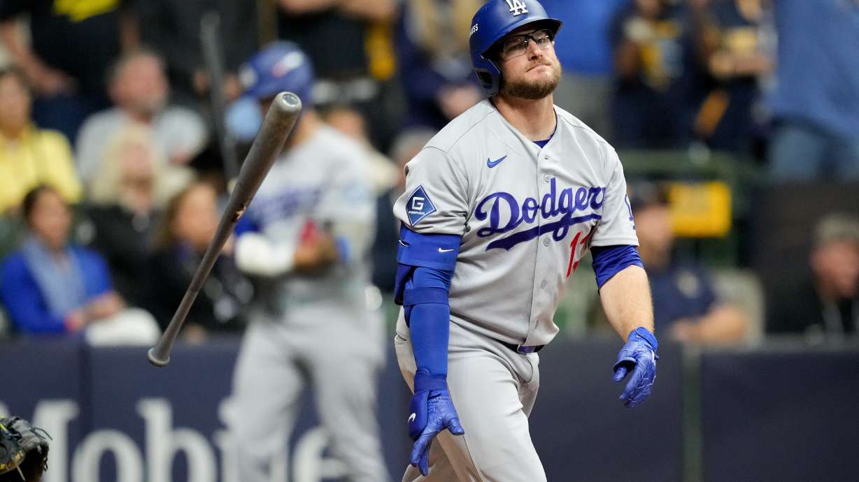 Los Angeles Dodgers third baseman Max Muncy flips his bat after popping out during the ninth inning of Game 1 of baseball's National League Championship Series between the Milwaukee Brewers and the Los Angeles Dodgers, Sunday, Oct. 11, 2026, in Milwaukee.