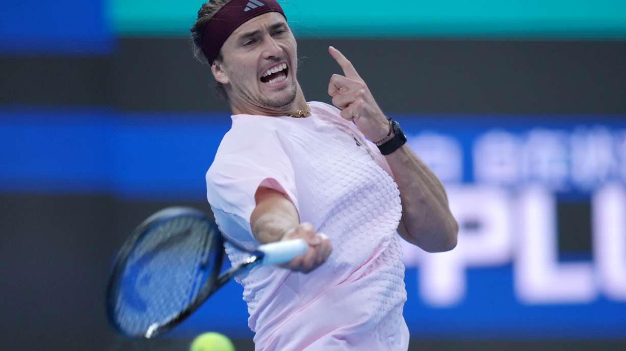 Alexander Zverev, of Germany, returns a ball to Novak Djokovic, of Serbia, during the men's singles quarterfinals match at the China Open tennis tournament in Beijing, Sunday, Oct. 4, 2026.