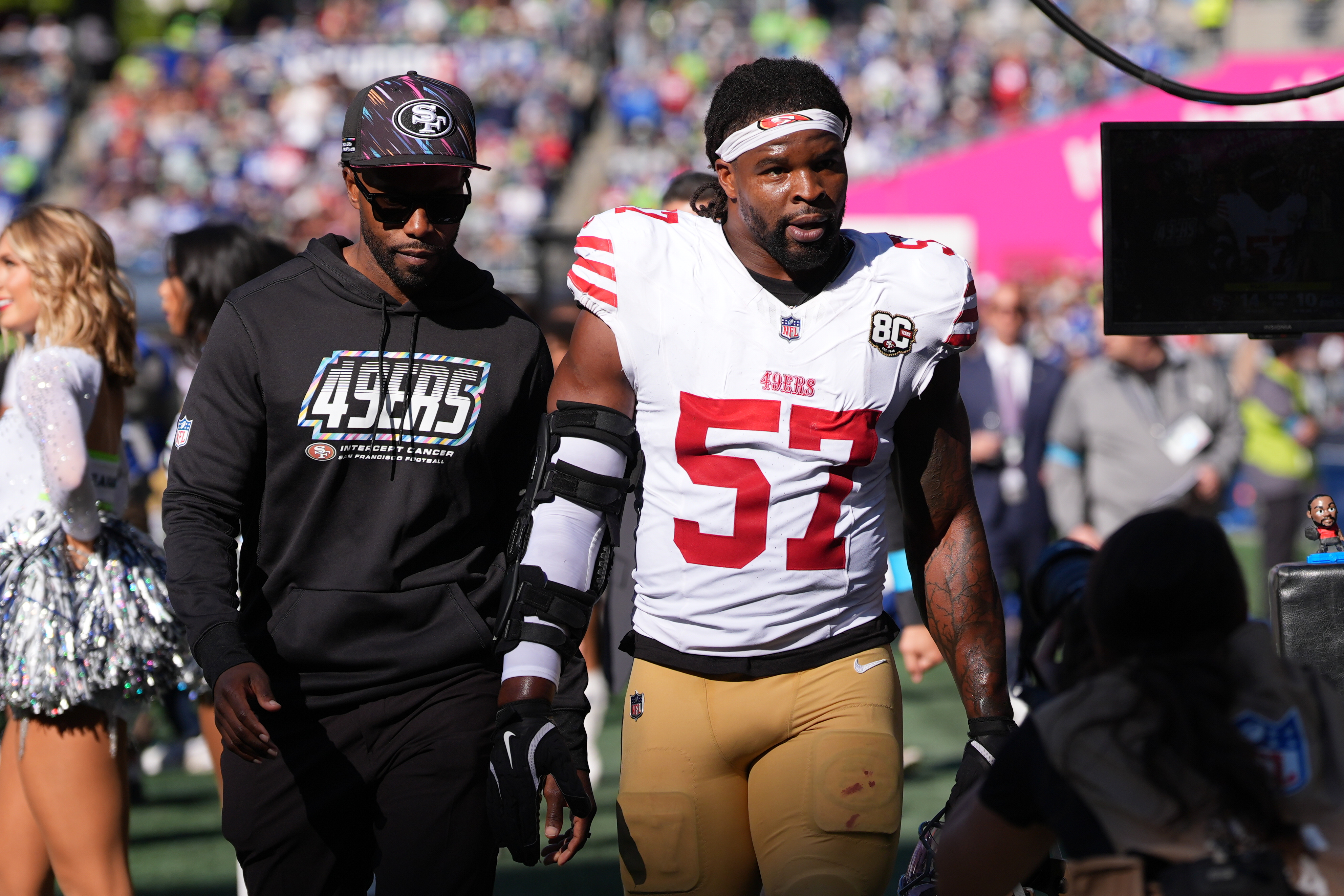 San Francisco 49ers linebacker Dre Greenlaw (57) leaves the field after being ejected during the first half of an NFL football game against the Seattle Seahawks, Sunday, Oct. 11, 2026, in Seattle. 