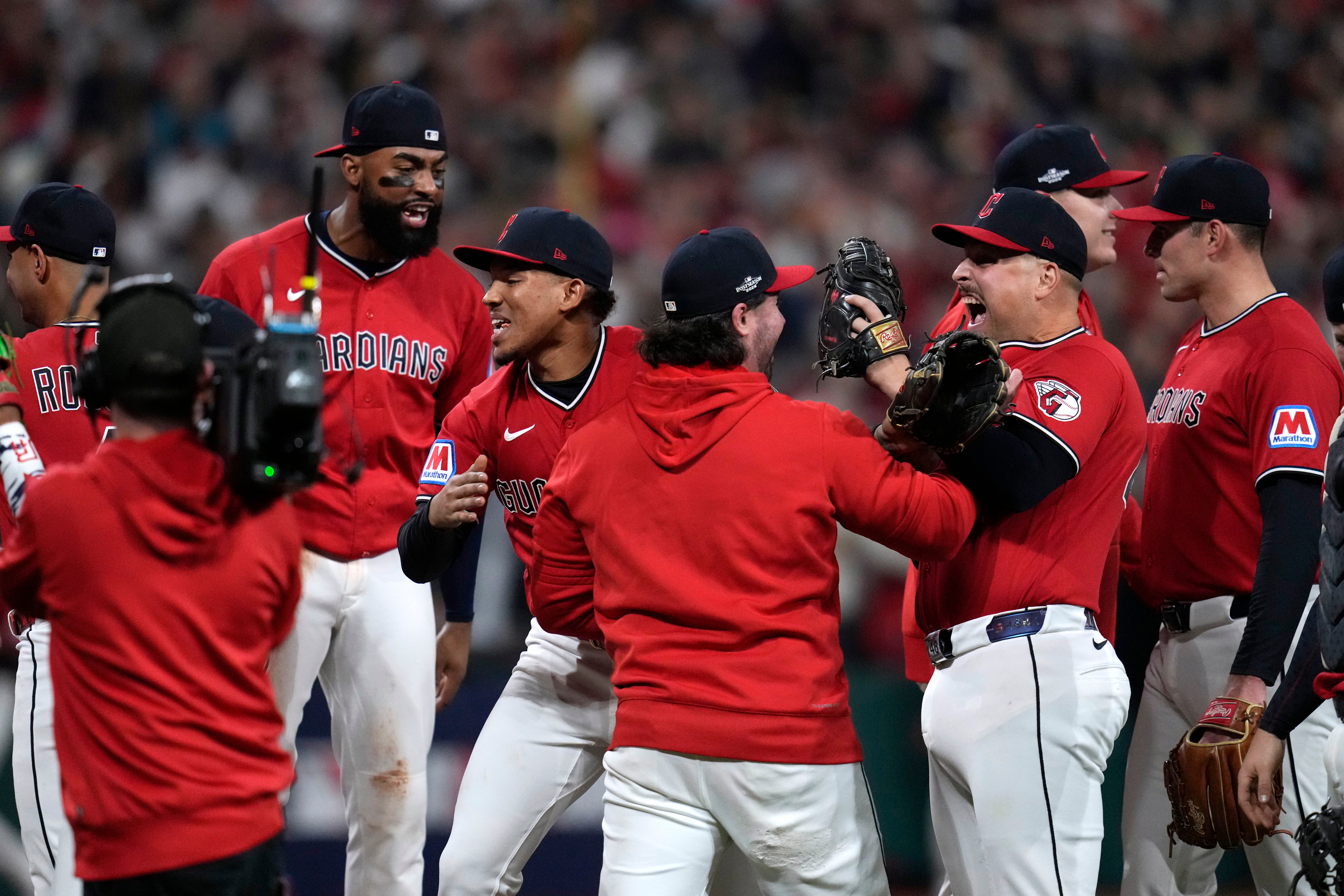 Cleveland Guardians players celebrate after Game 5 of baseball's American League Division Series against the Chicago White Sox, Saturday, Oct. 10, 2026, in Cleveland. 