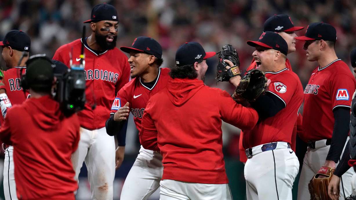 Cleveland Guardians players celebrate after Game 5 of baseball's American League Division Series against the Chicago White Sox, Saturday, Oct. 10, 2026, in Cleveland.