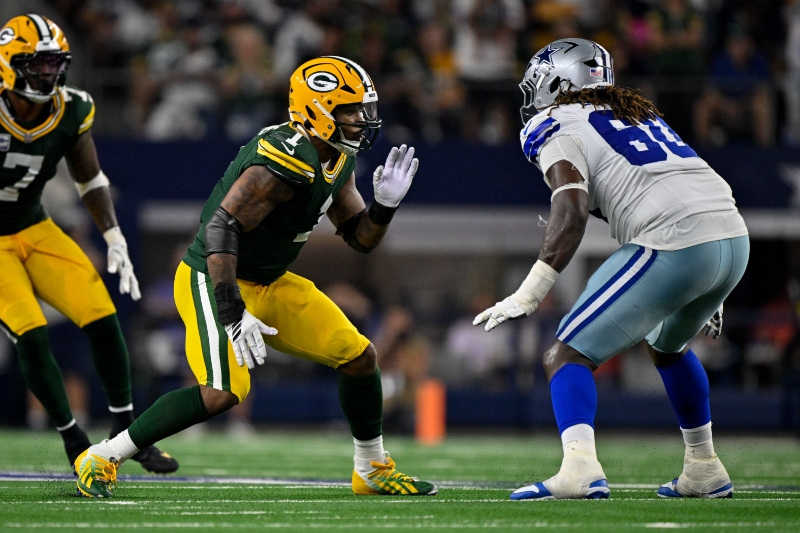 Sep 28, 2025; Arlington, Texas, USA; Dallas Cowboys offensive tackle Tyler Guyton (60) drops back to block the rush of Green Bay Packers defensive end Micah Parsons (1) during the game between the Dallas Cowboys and the Green Bay Packers at AT&T Stadium.