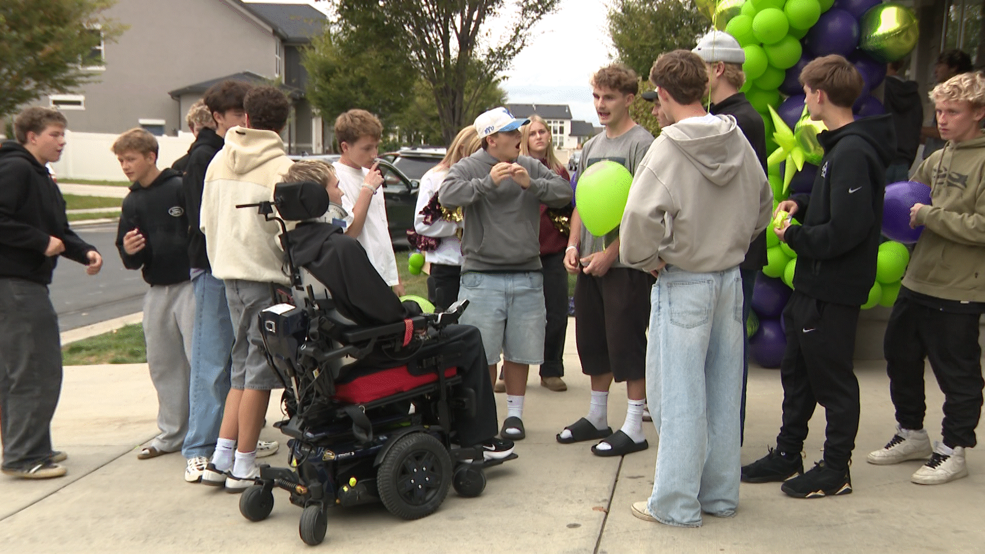 Gunnar Olsen is greeted by a crowd as he comes home from the hospital.