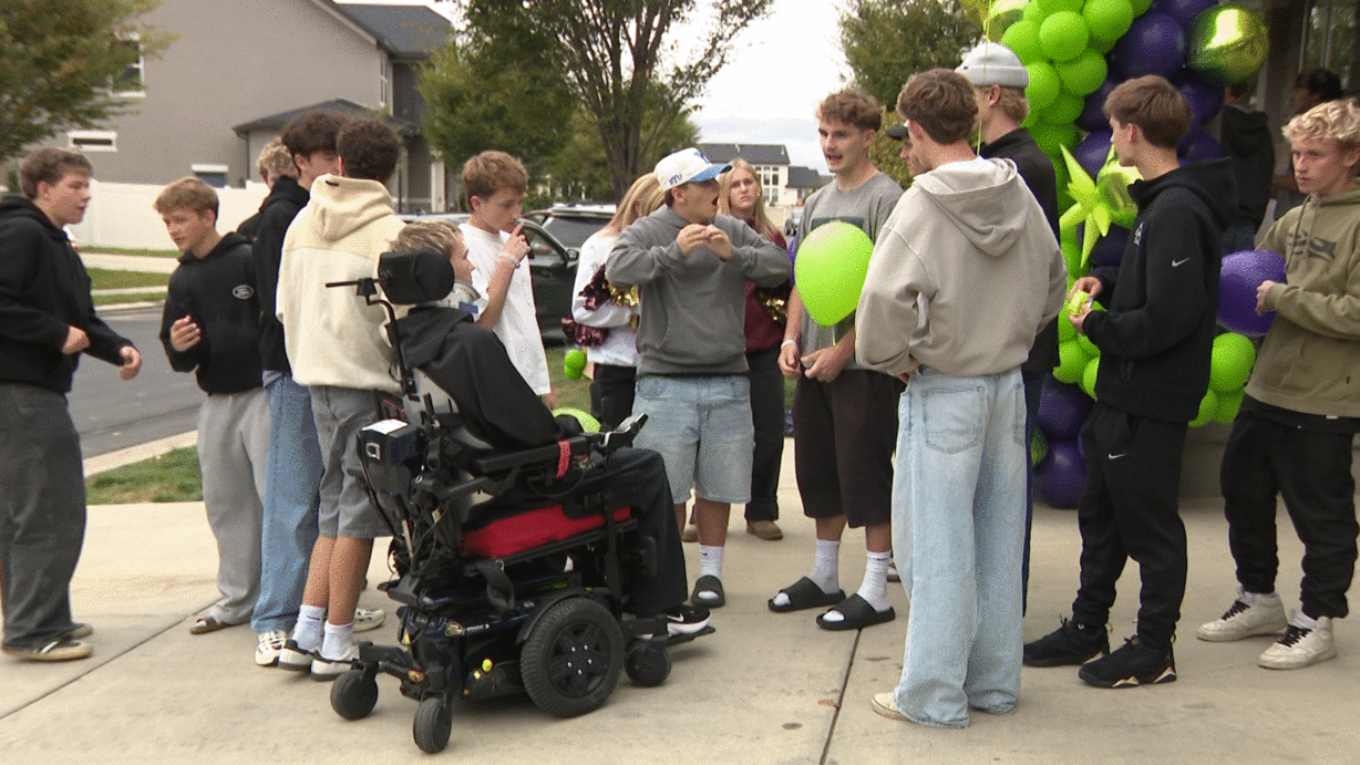 Gunnar Olsen is greeted by a crowd as he comes home from the hospital.