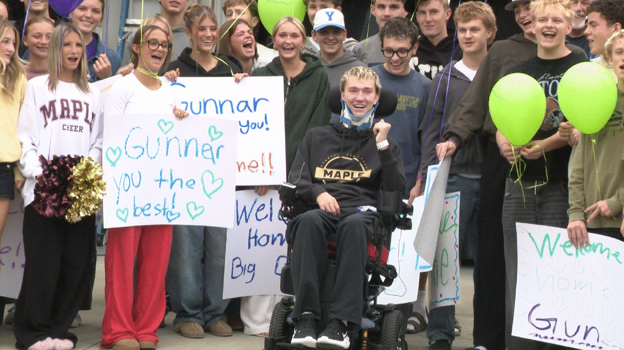Gunnar Olsen is greeted by a crowd as he comes home from the hospital. After months in the hospital and rehabilitation, he received a warm welcome from family, friends and neighbors who gathered to celebrate a milestone in his recovery.