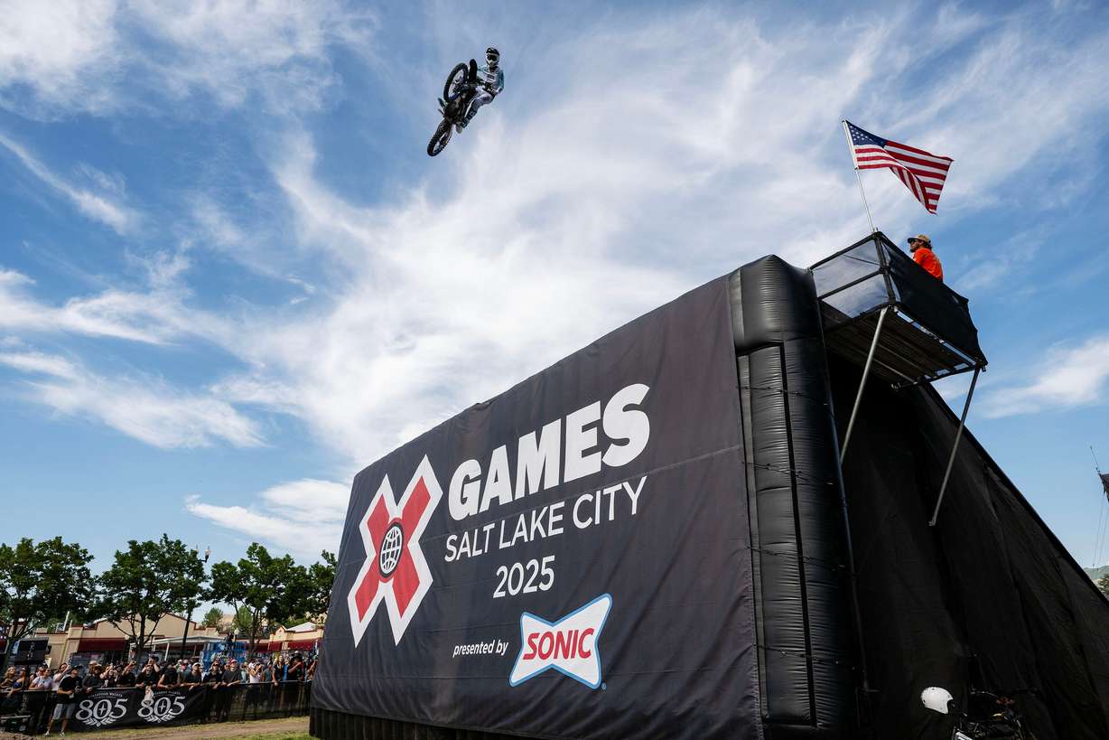 A Moto X rider flies through the air as competitors compete in the X Games at Utah State Fairpark in Salt Lake City on June 28, 2025.