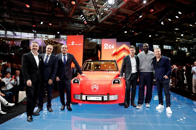 Gilles Vidal, Design Vice President for Stellantis Europe,  Emanuele Cappellano, Chief Operating Officer (COO) for Enlarged Europe & European Brands and Head of Stellantis Pro One, Antonio Filosa, CEO of Stellantis, Xavier Chardon, CEO of Citroen and DS brands, Omar Sy, Pierre Leclercq, head of Citroen design, pose near the new electric Citroen 2CV concept car during a press conference on media day at the 2026 Paris Auto Show in Paris, France, October 12, 2026.