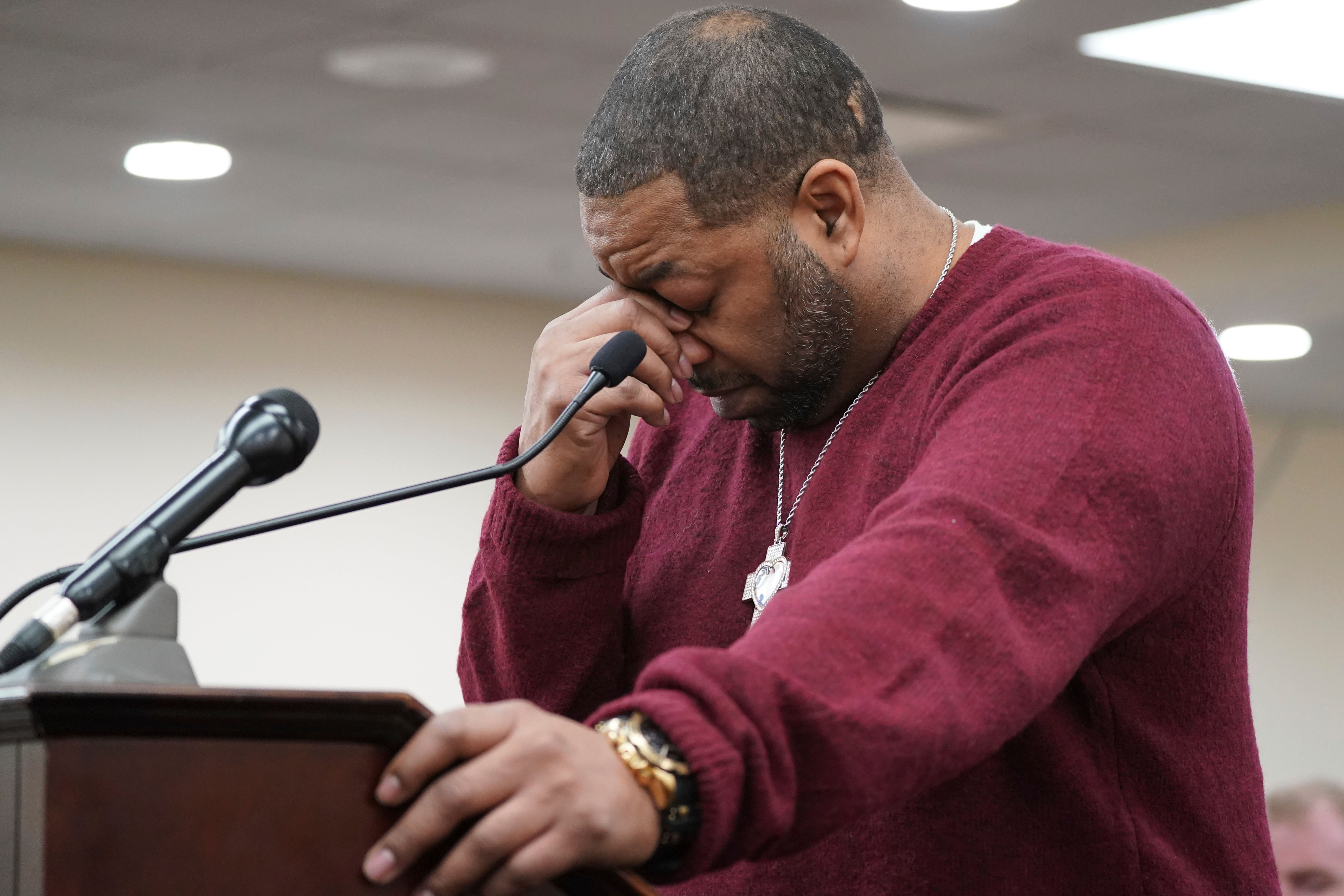 Wayne Jones, the son of Tops Friendly Market shooting victim Celestine Chaney, pauses to collect himself as he makes a statement to the court during the sentencing of Payton Gendron before Erie County Court Judge Susan Eagan, Feb. 15, 2023, in Buffalo, N.Y. Jury selection in Gendron's hate crimes trial began on Tuesday.