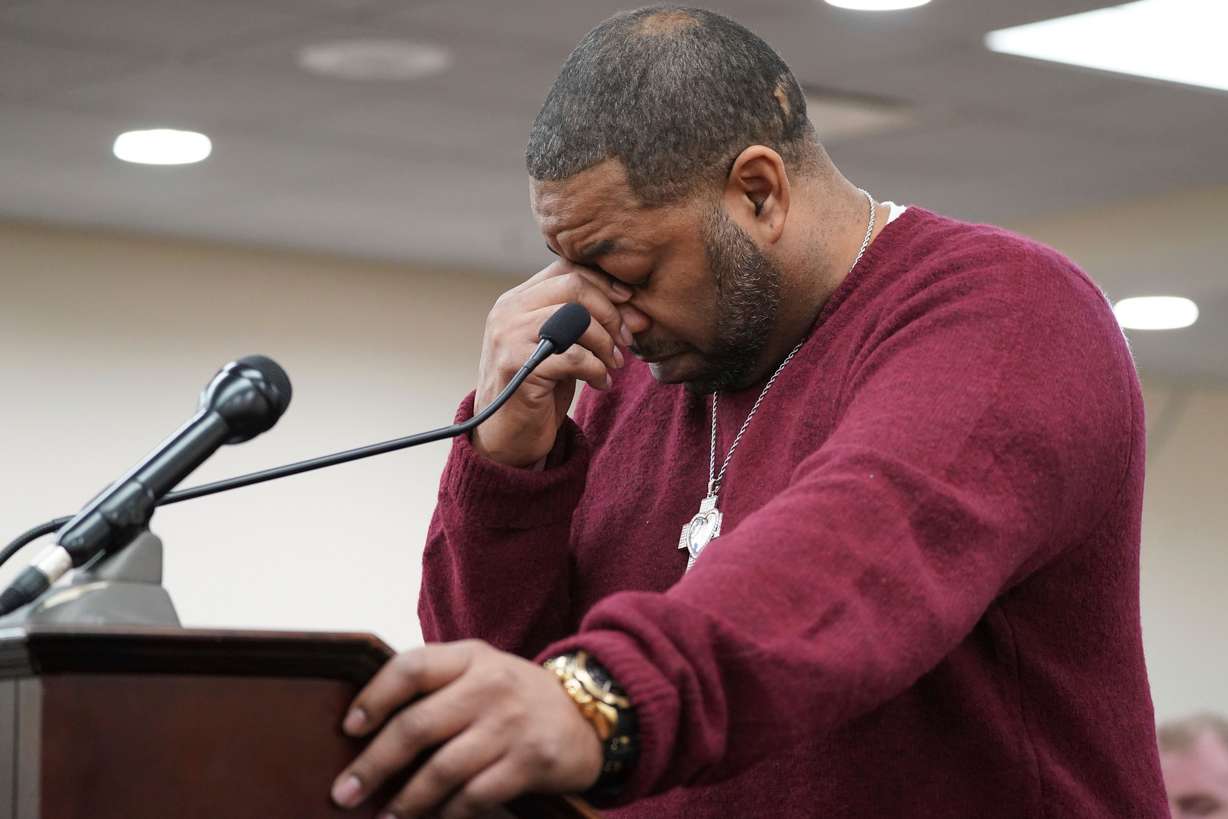 Wayne Jones, the son of Tops Friendly Market shooting victim Celestine Chaney, pauses to collect himself as he makes a statement to the court during the sentencing of Payton Gendron before Erie County Court Judge Susan Eagan, Feb. 15, 2023, in Buffalo, N.Y. Jury selection in Gendron's hate crimes trial began on Tuesday.