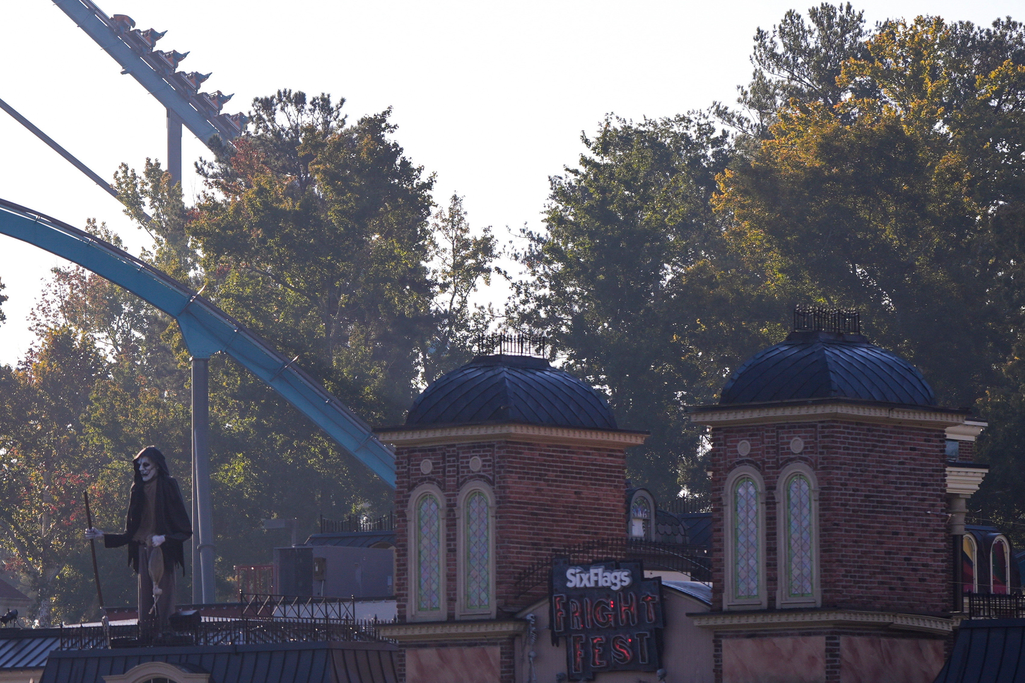 Attractions are seen at Six Flags Over Georgia, about 15 miles northwest of Atlanta, Tuesday. A man was killed after he was thrown from his seat on a roller coaster at the park, police said on Tuesday.