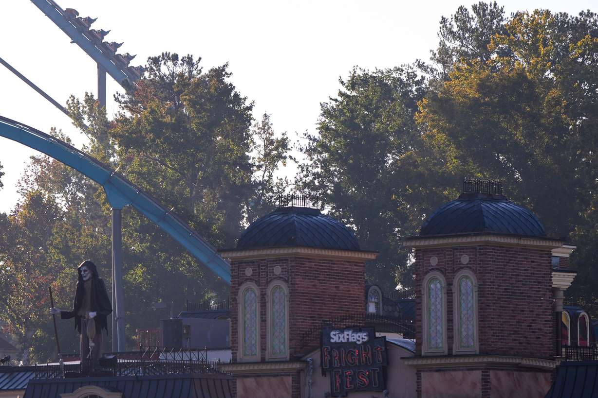 Attractions are seen at Six Flags Over Georgia, about 15 miles northwest of Atlanta, Tuesday. A man was killed after he was thrown from his seat on a roller coaster at the park, police said on Tuesday.