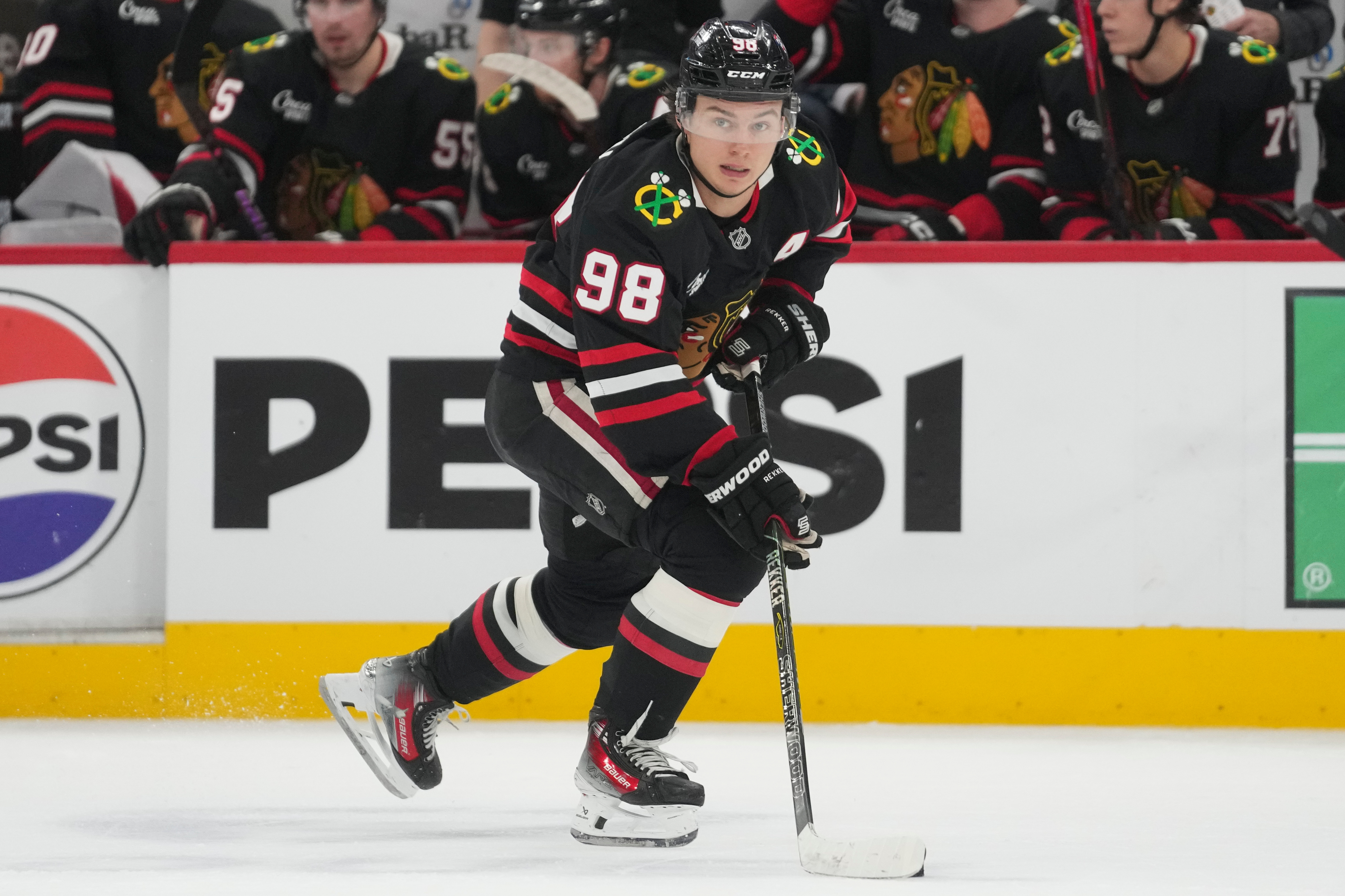 FILE - Chicago Blackhawks center Connor Bedard handles the puck during the second period of an NHL hockey game against the Colorado Avalanche, March 20, 2026, in Chicago. 