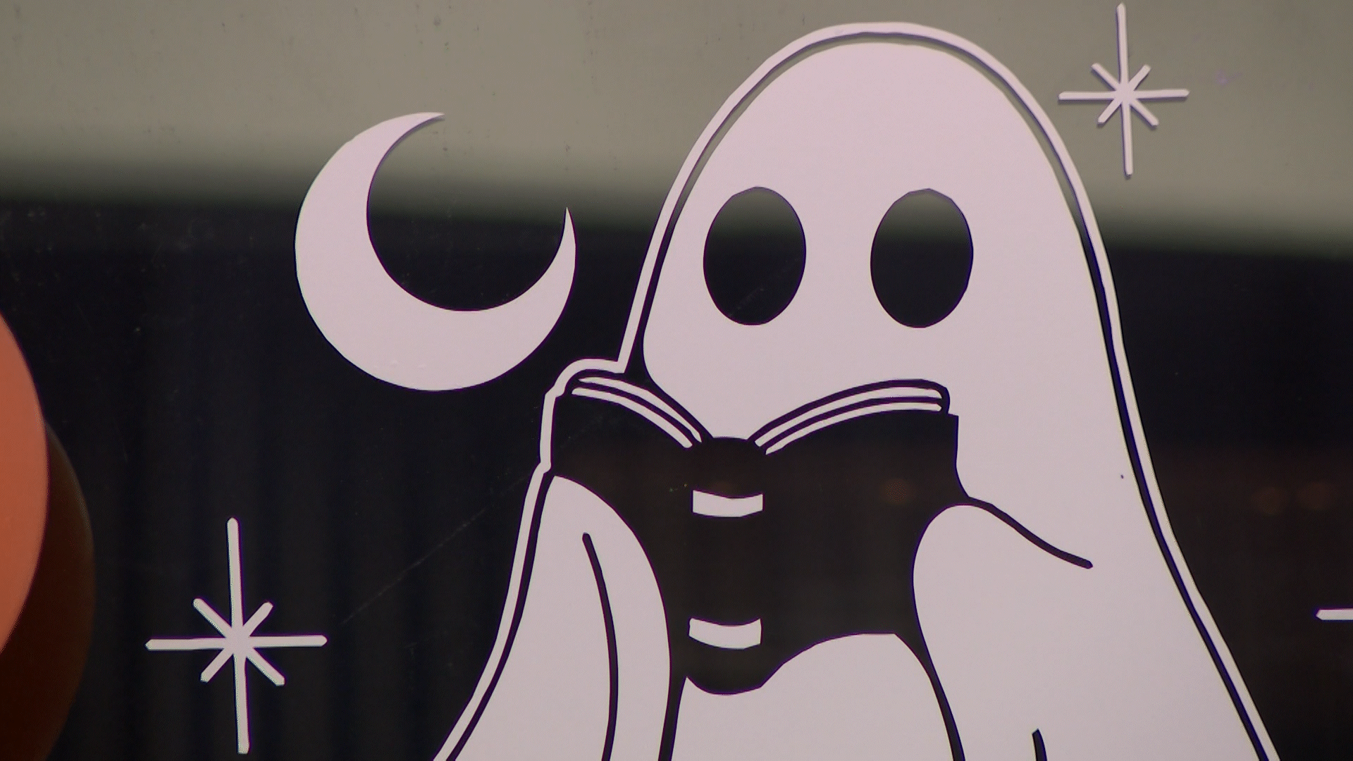 A cartoon ghost reading a book is pictured at Nocturnal Nook Novelties in Lehi on Tuesday.